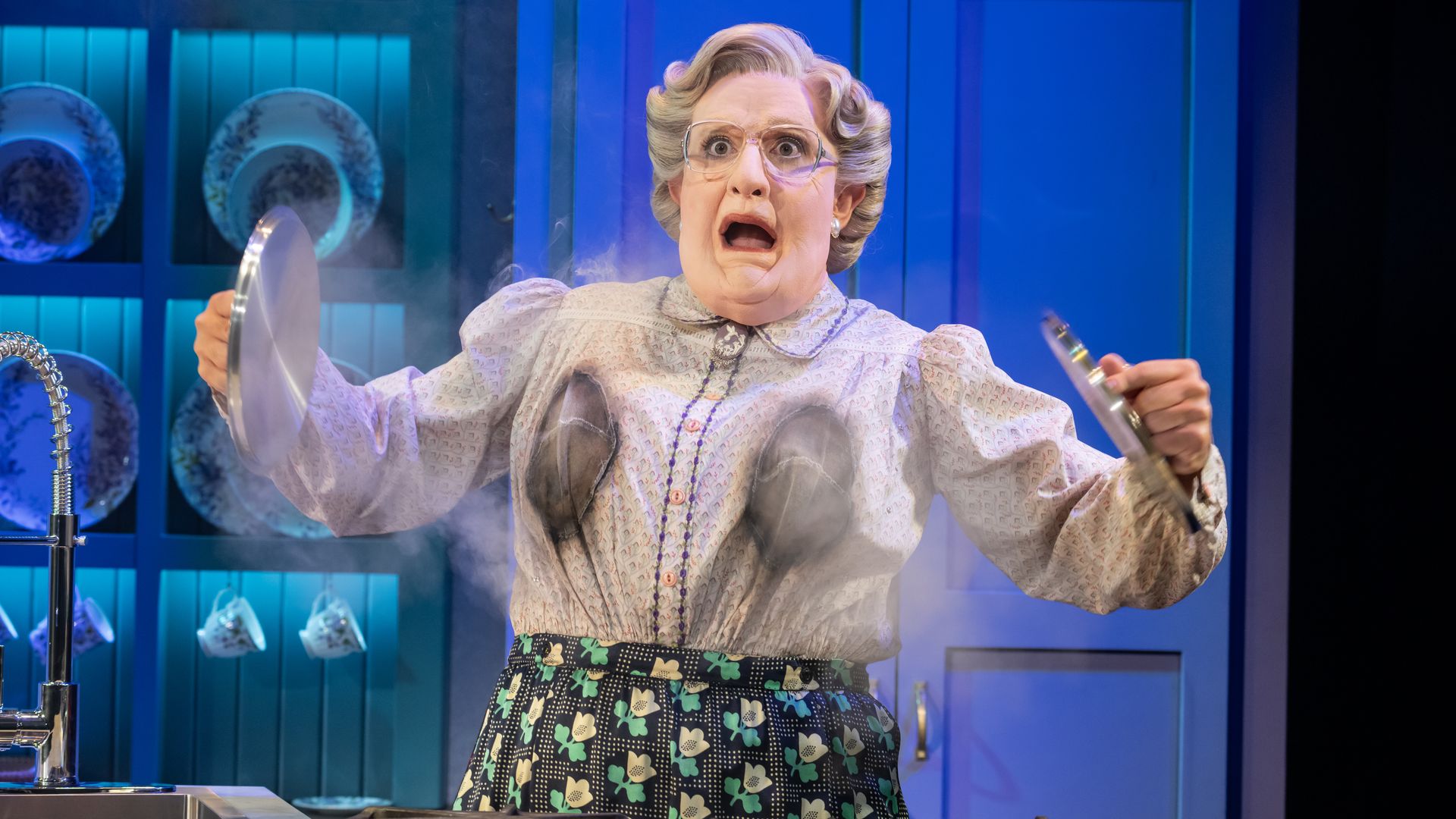 An actor plays Mrs. Doubtfire in a musical version of the film. 