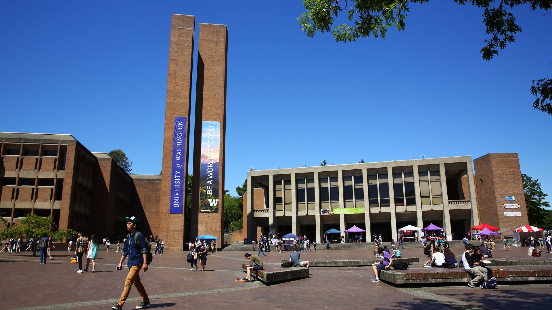 A photo of buildings and students on a university  campus.