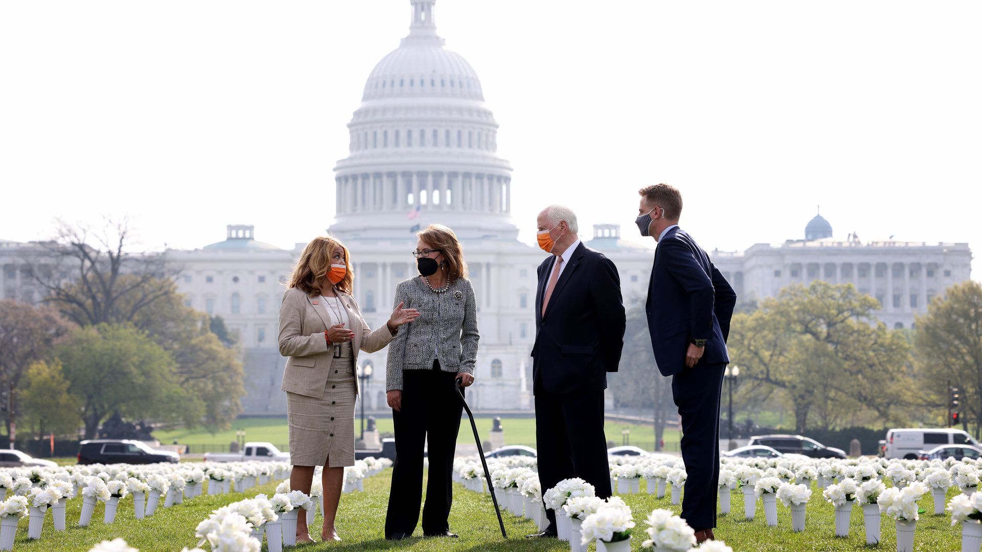 Former Rep. Gabby Giffords is seen standing amid a memorial to shooting victims that was erected on the National Mall.