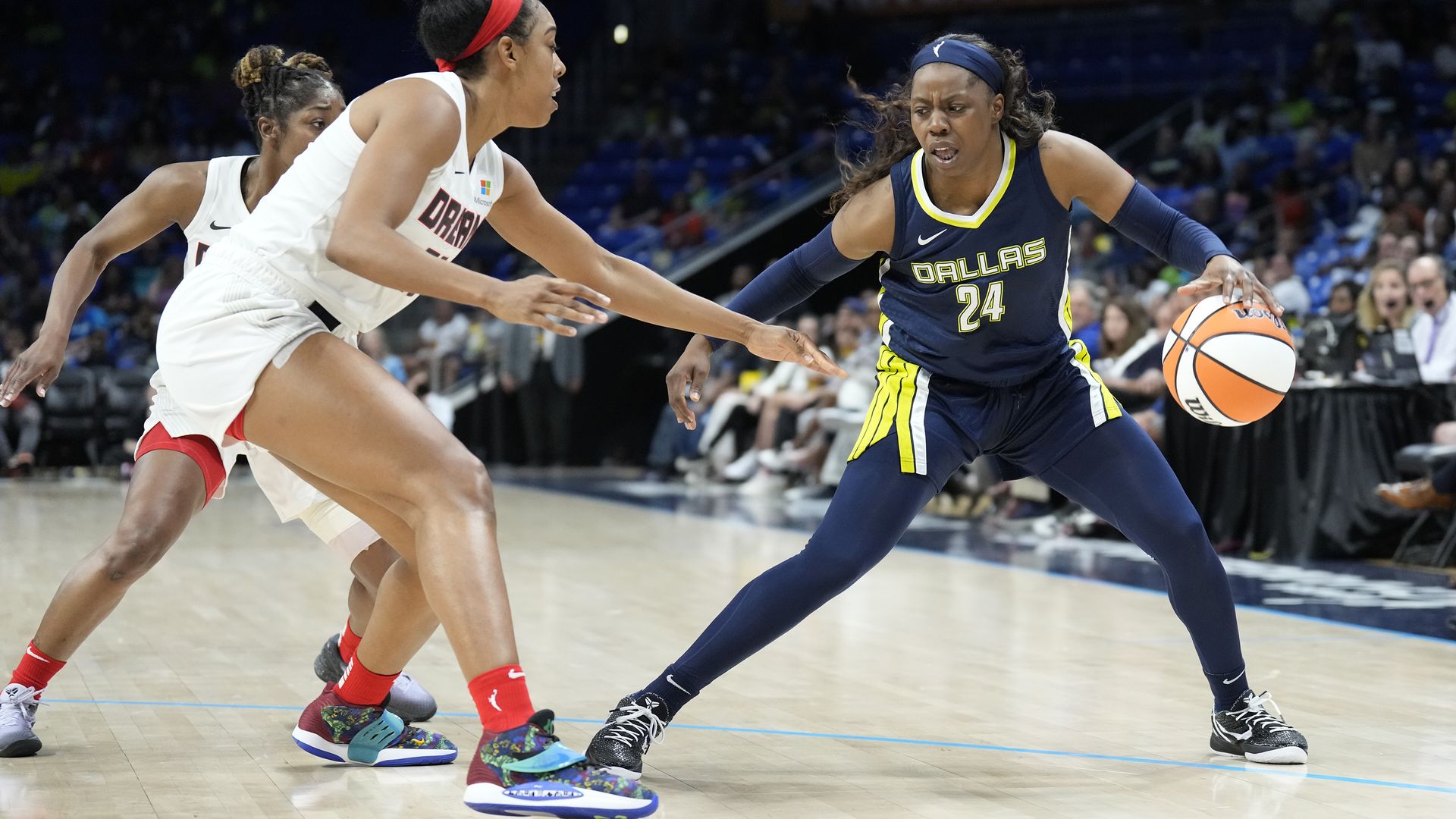 Arike Ogunbowale #24 of the Dallas Wings handles the ball during the game against the Atlanta Dream 