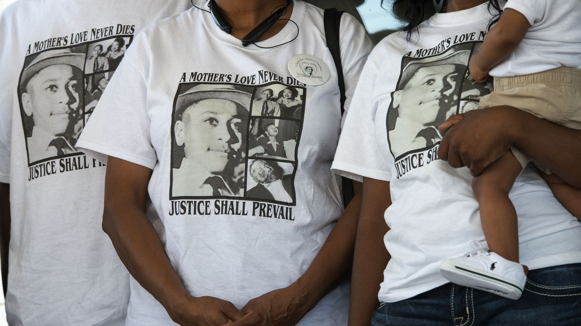 Descendants of Emmett Hill wearing t-shirts with images of Till on them