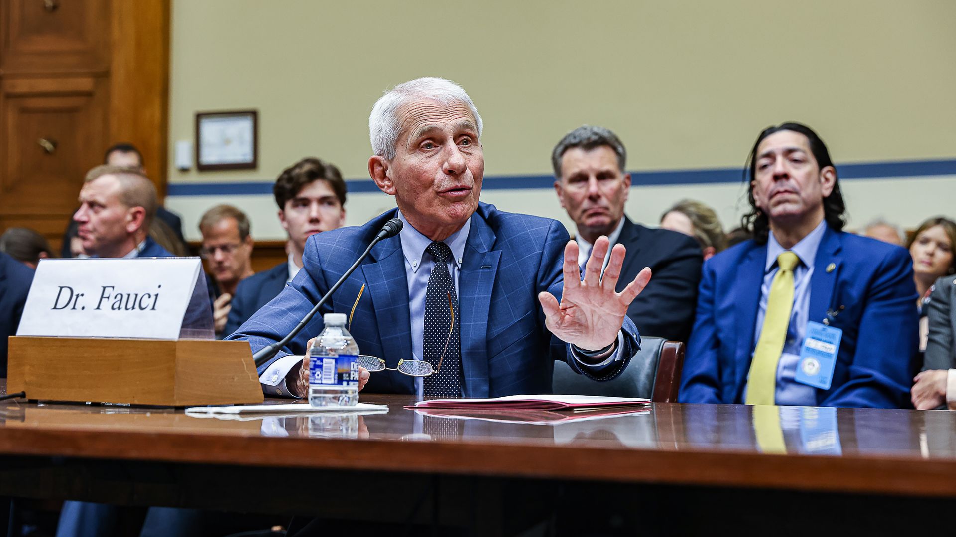 Dr. Anthony Fauci, wearing a blue suit and sitting in a committee hearing.