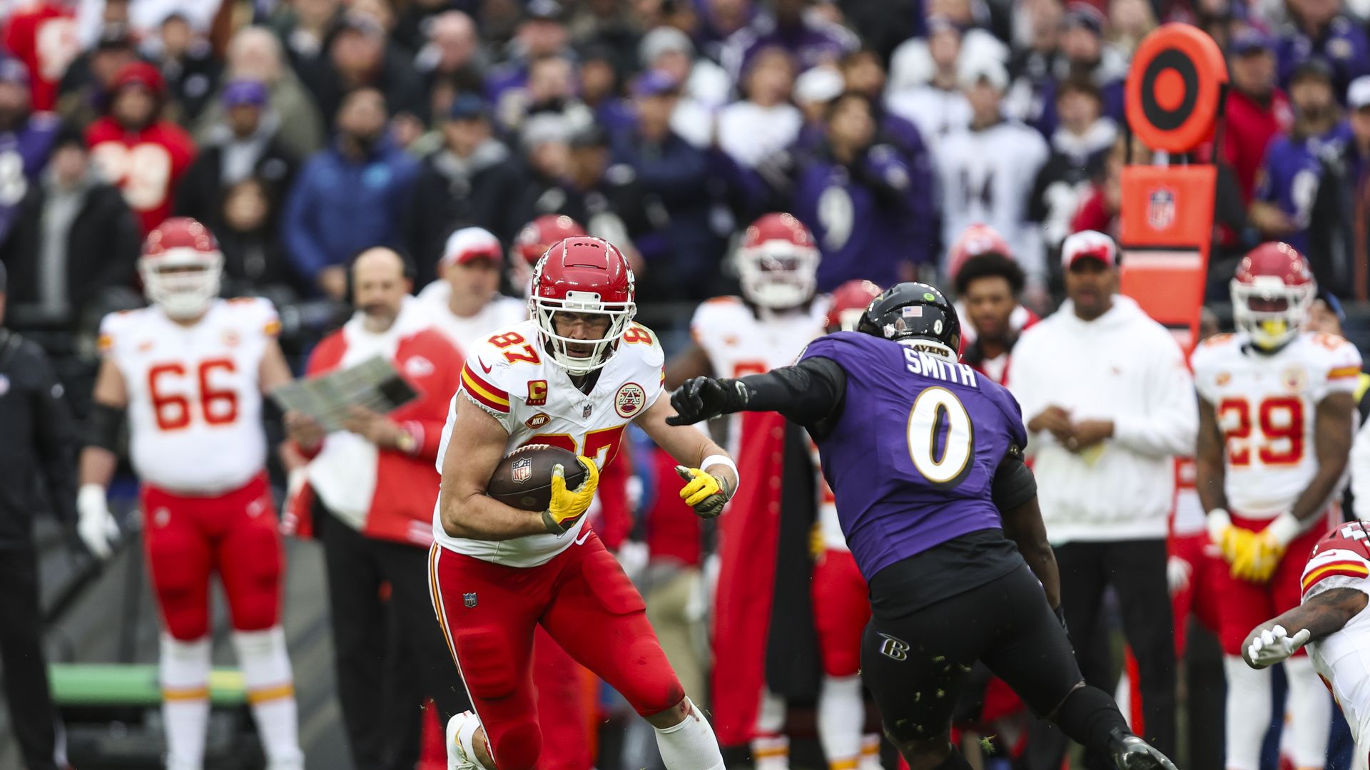 Travis Kelce #87 of the Kansas City Chiefs runs the ball during the AFC Championship NFL football game against the Baltimore Ravens at M&T Bank Stadium on January 28, 2024 in Baltimore, Maryland.