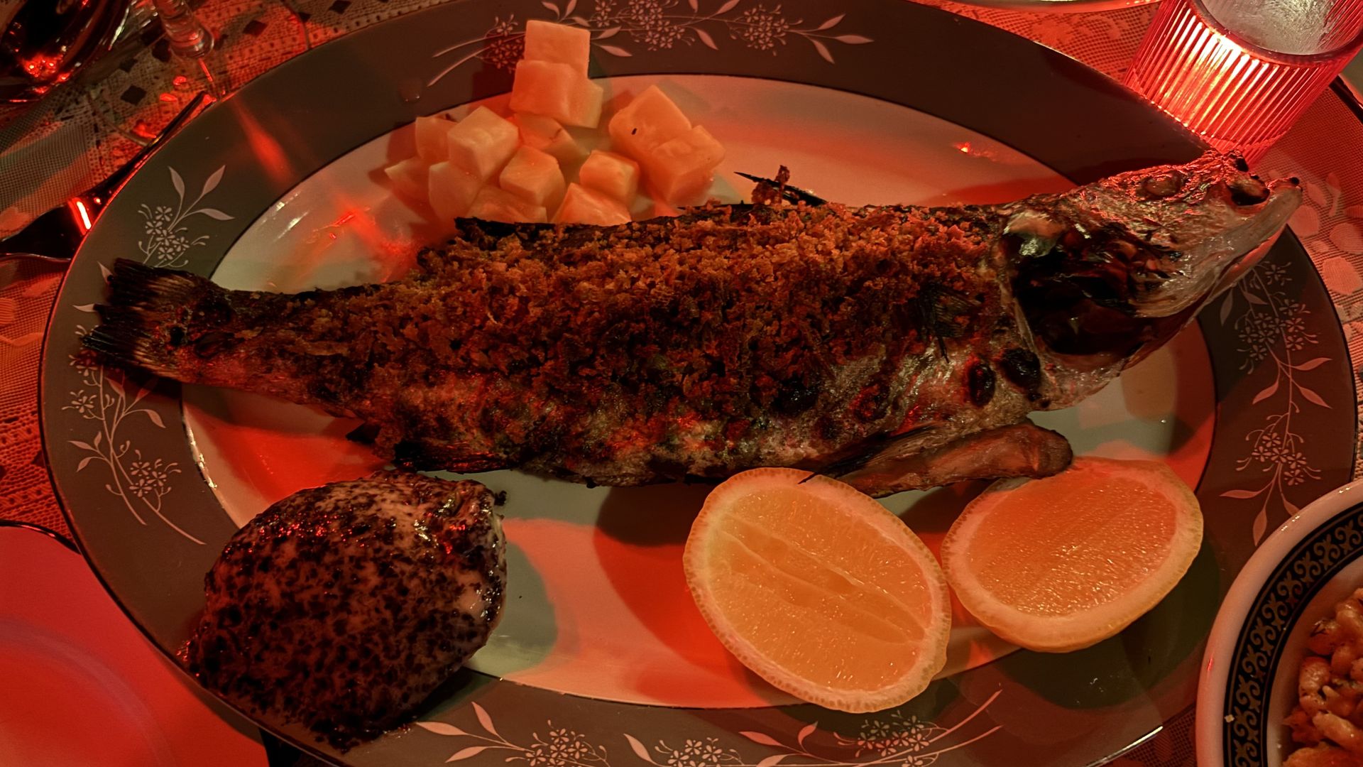 the whole grilled branzino served with seaweed butter and pickled vegetables
