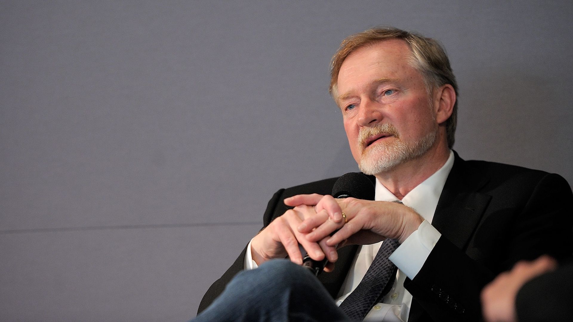 Author Erik Larson sitting with his hands clasped.