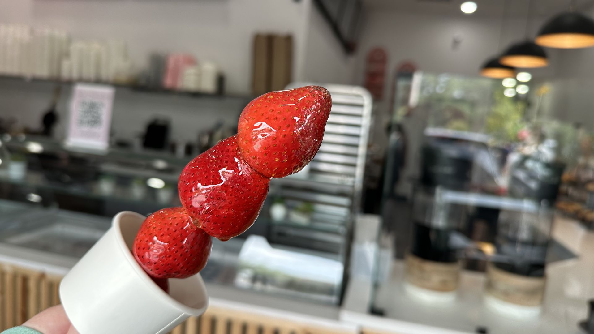 Photo shows strawberry tonghulu candy at Sweet HandKraft.