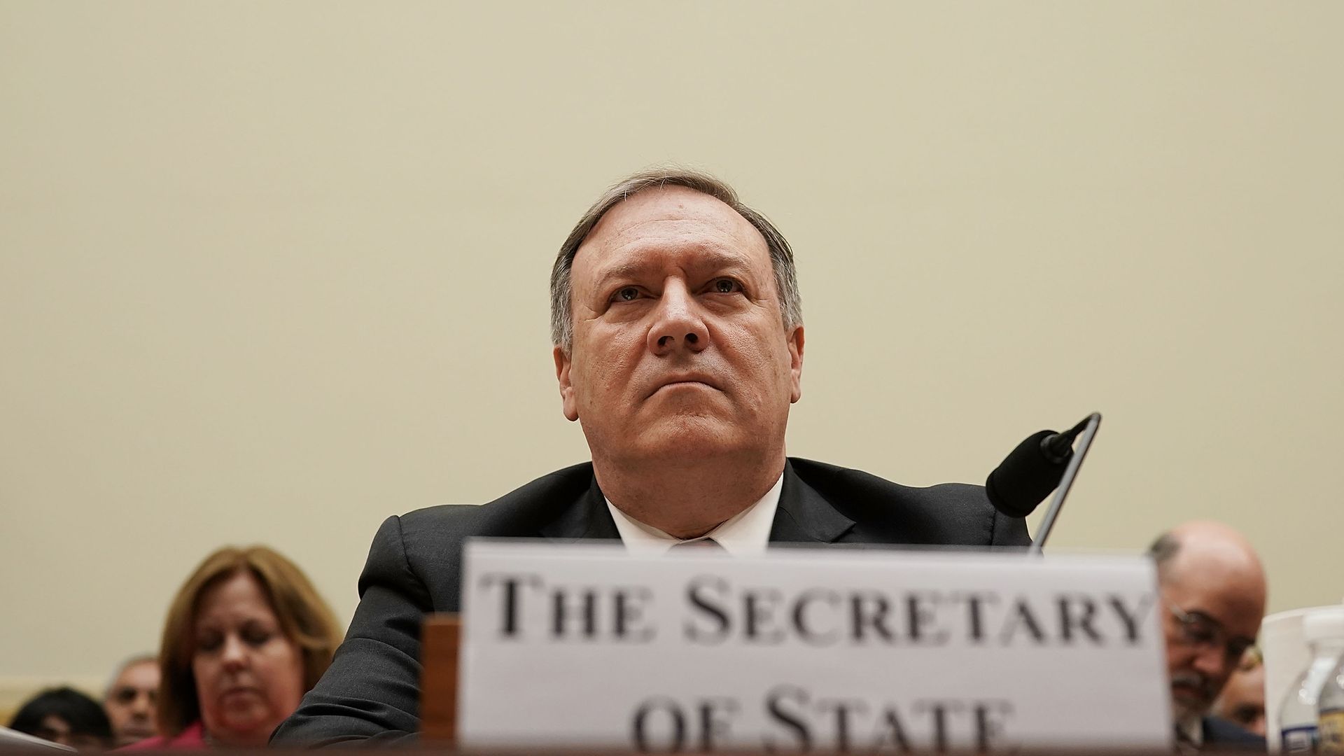 Mike Pompeo with a name plaque in front of him which reads "The Secretary of State" 