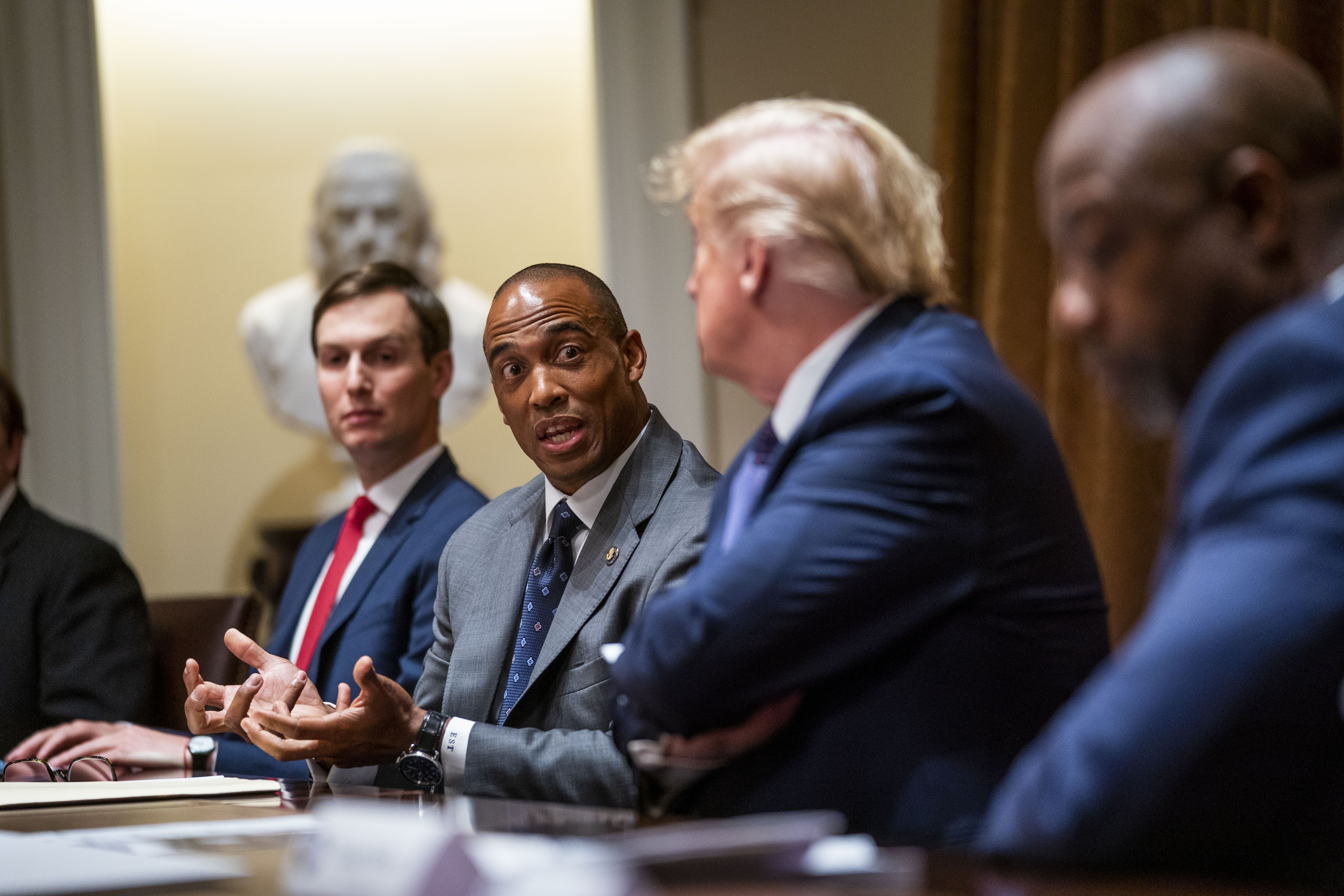 Scott Turner speaks with Donald Trump during a meeting in the Cabinet Room of the White House in 2020. 