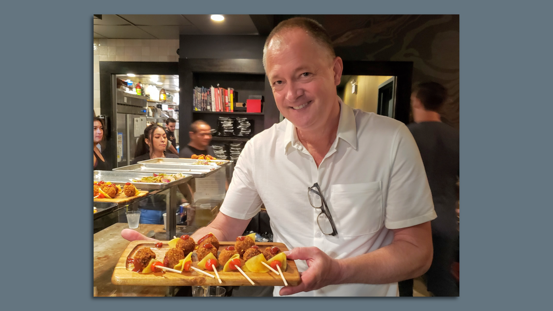man holding tray of food 