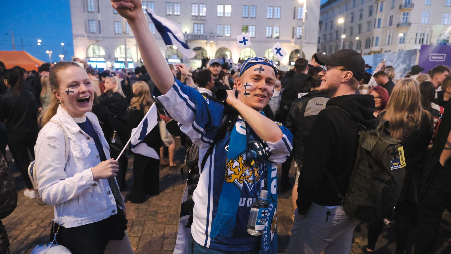 Ice hockey fans and revellers crowd the Kauppatori square in Helsinki on May 29.