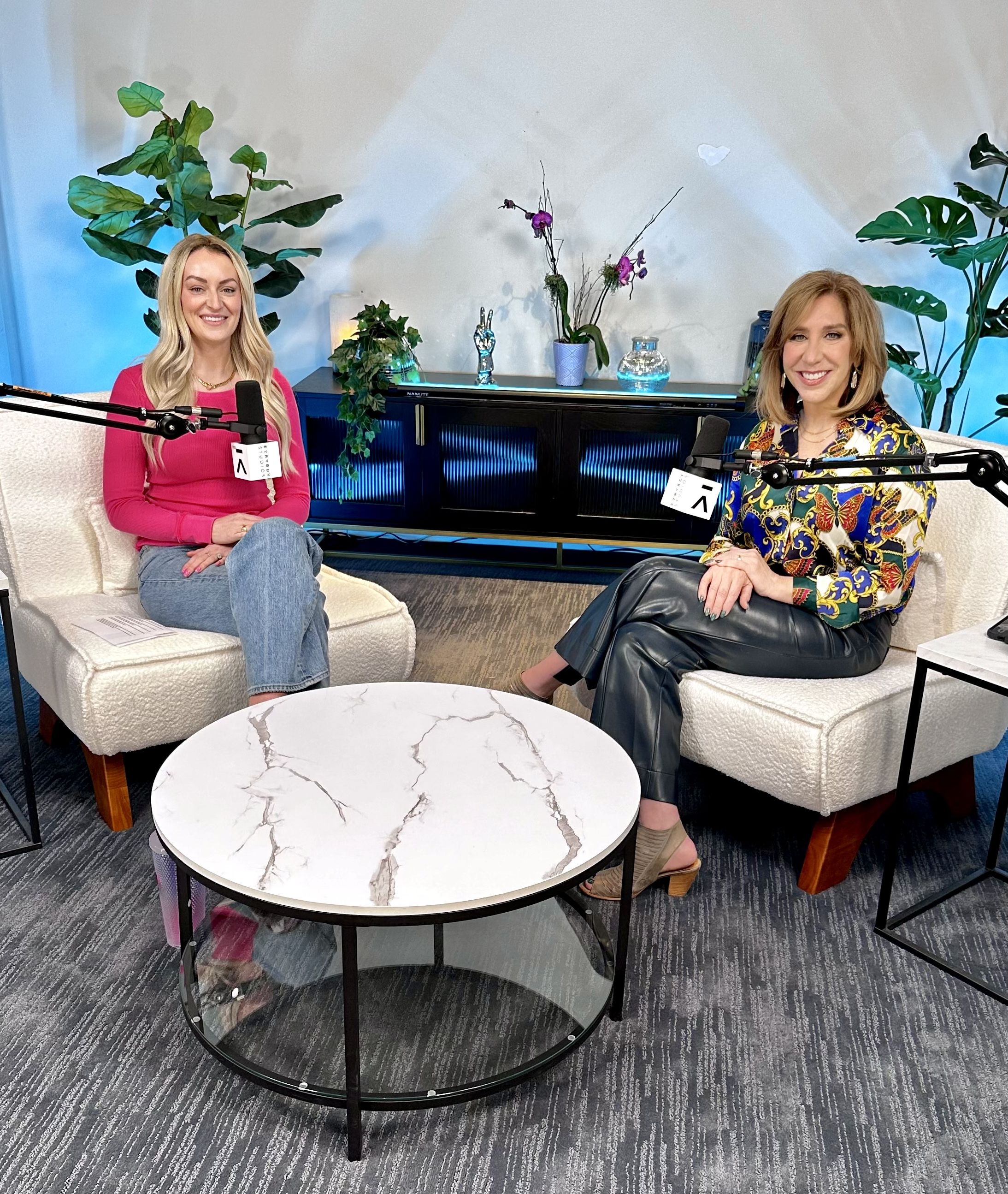 two women speaking into microphones