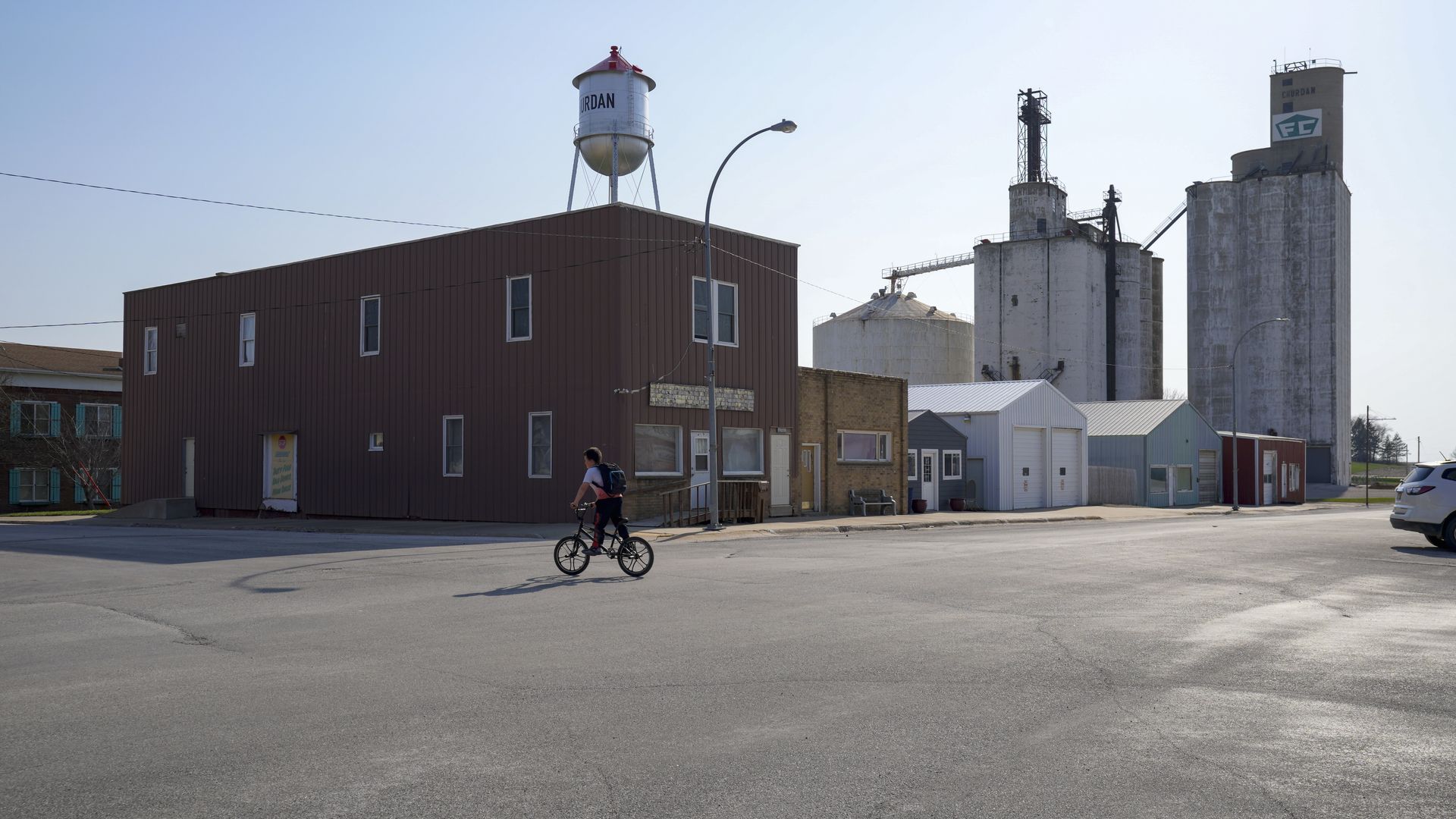 A young boy through a small town