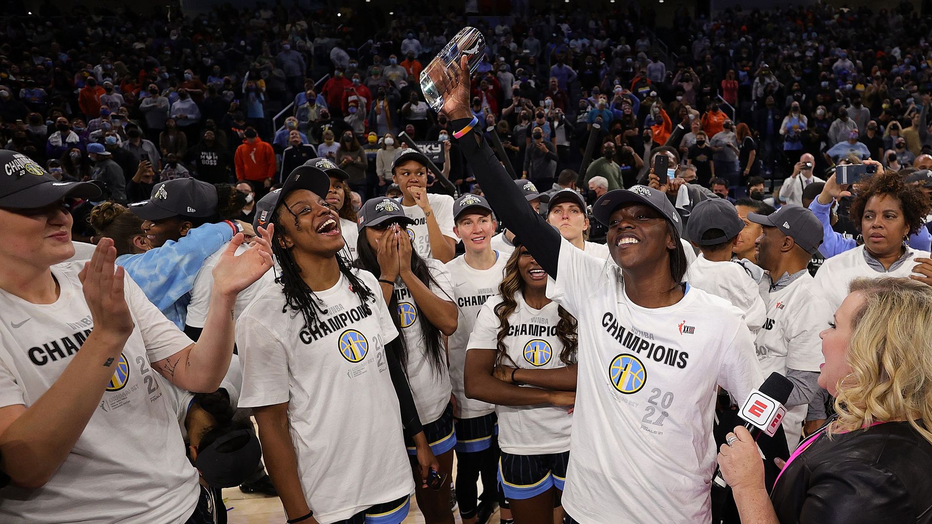 Players celebrate winning a basketball championship. 