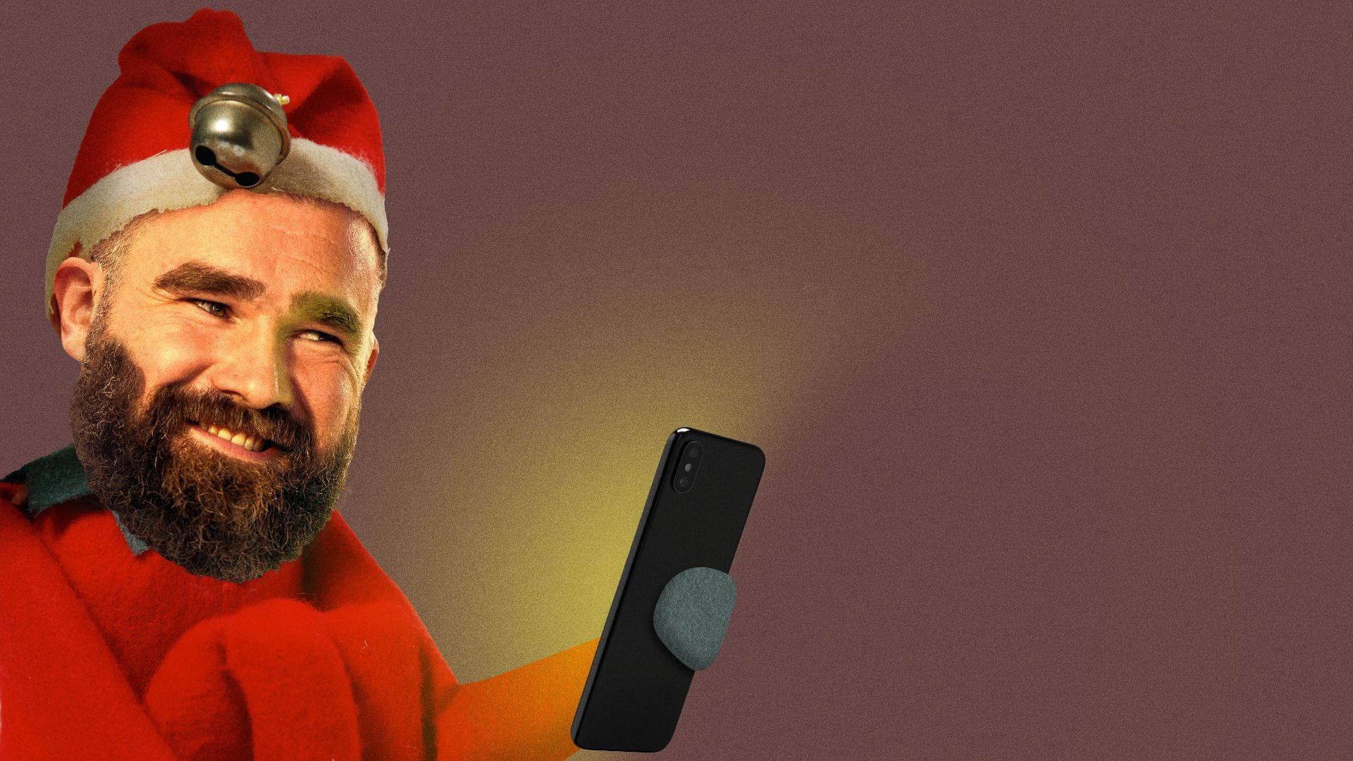 Jason Kelce as an elf on the shelf looking at a phone screen. 
