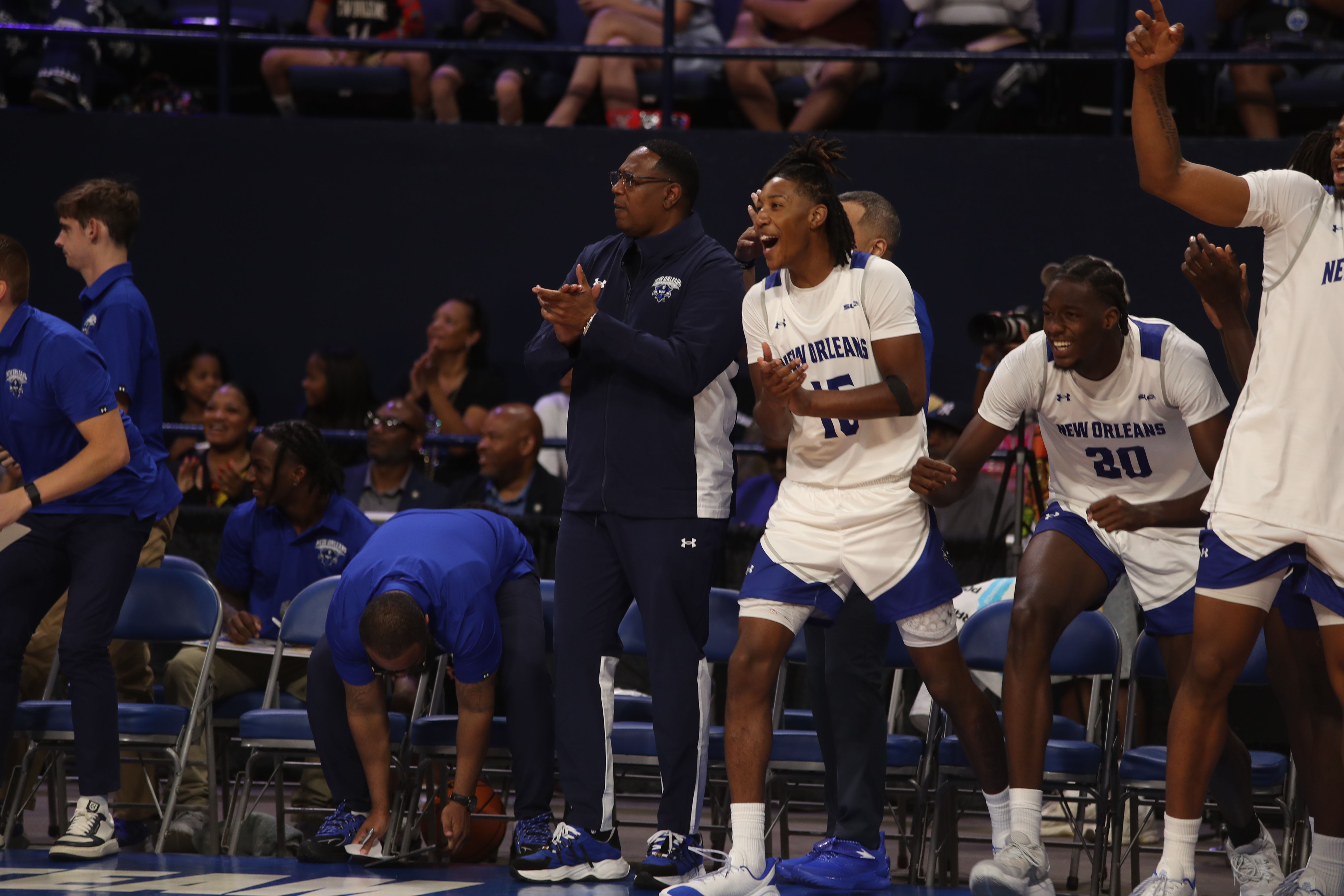 Percy “Coach P” Miller and UNO players erupt on the sidelines after a big play during their exhibition win over Sacramento State on Oct. 18. Photo by Malcolm Porter