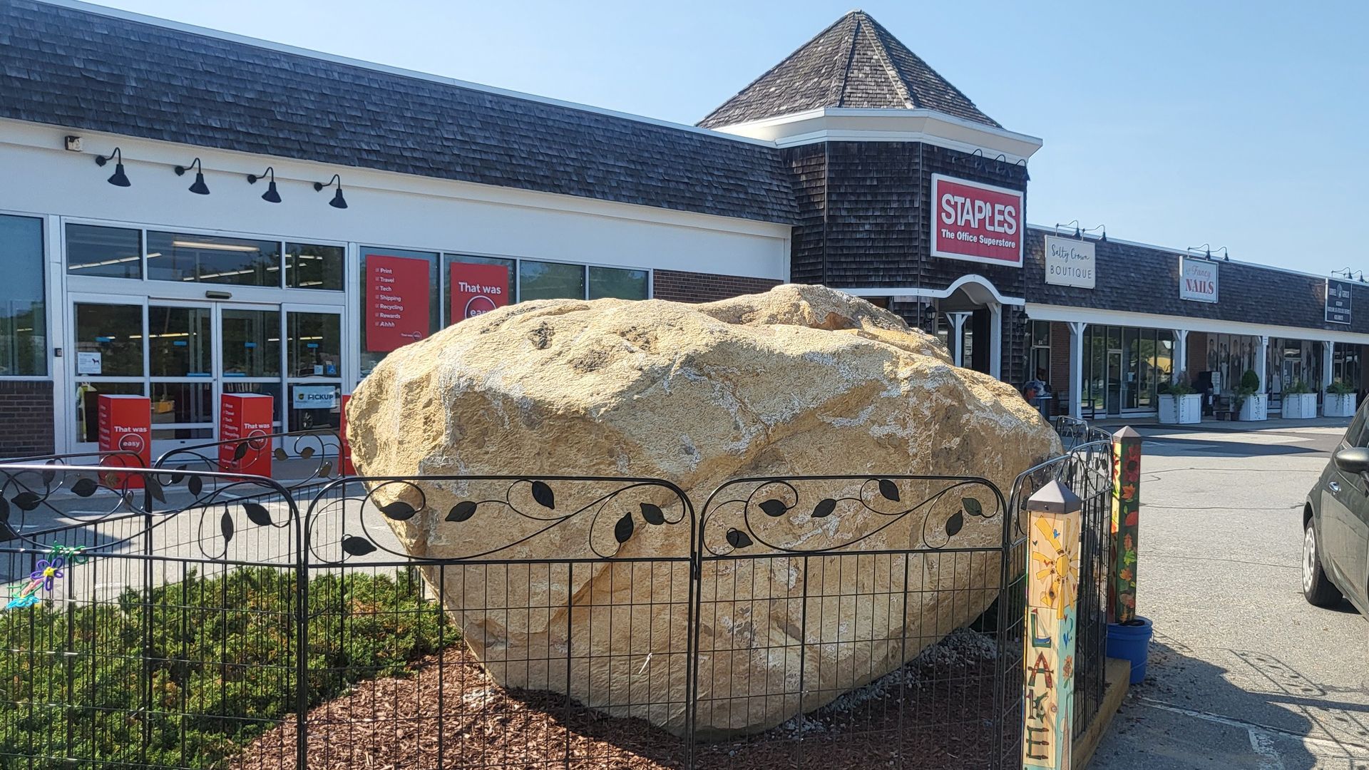 A rock in a parking lot