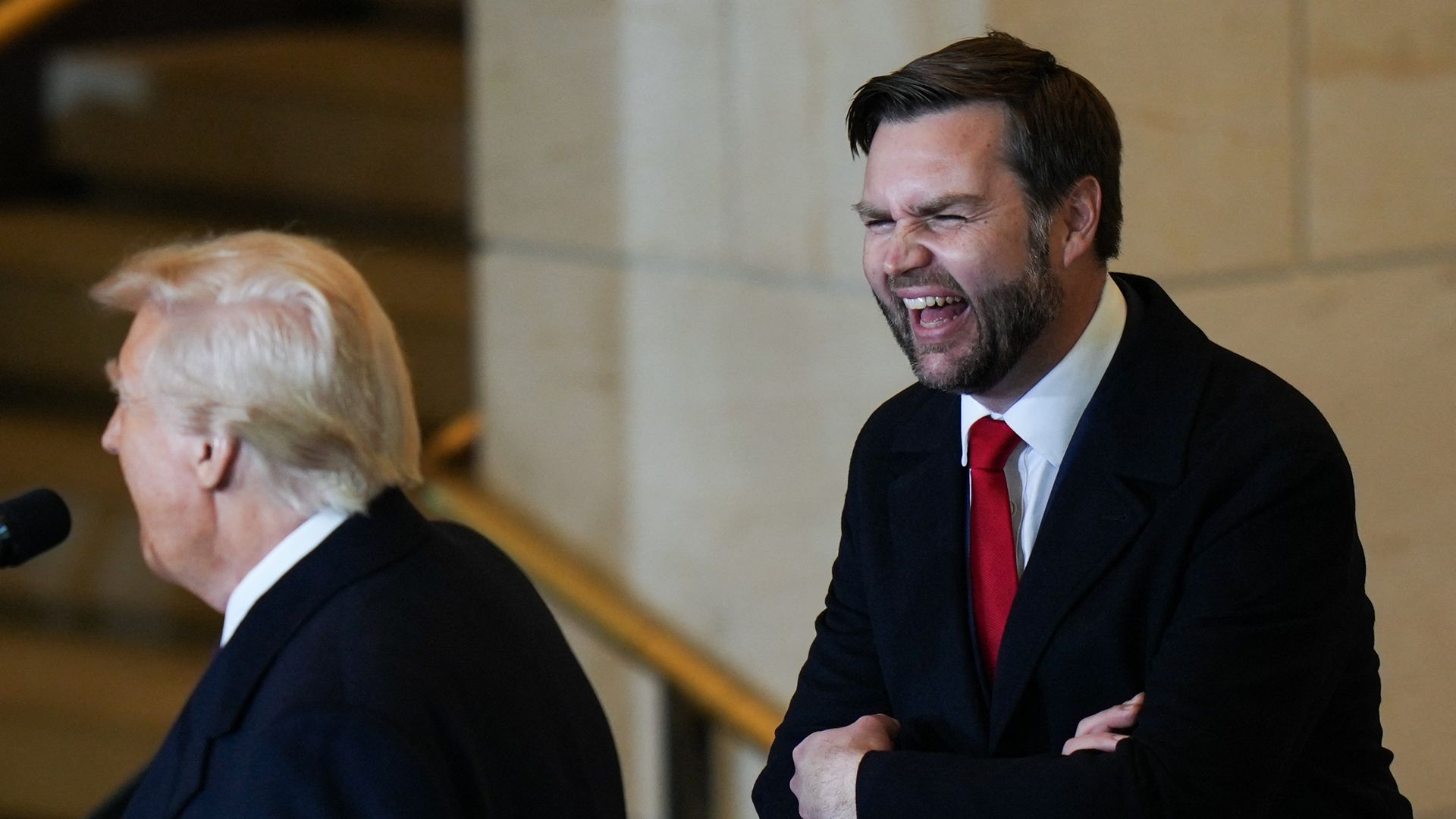 Vice President J.D. Vance laughs.