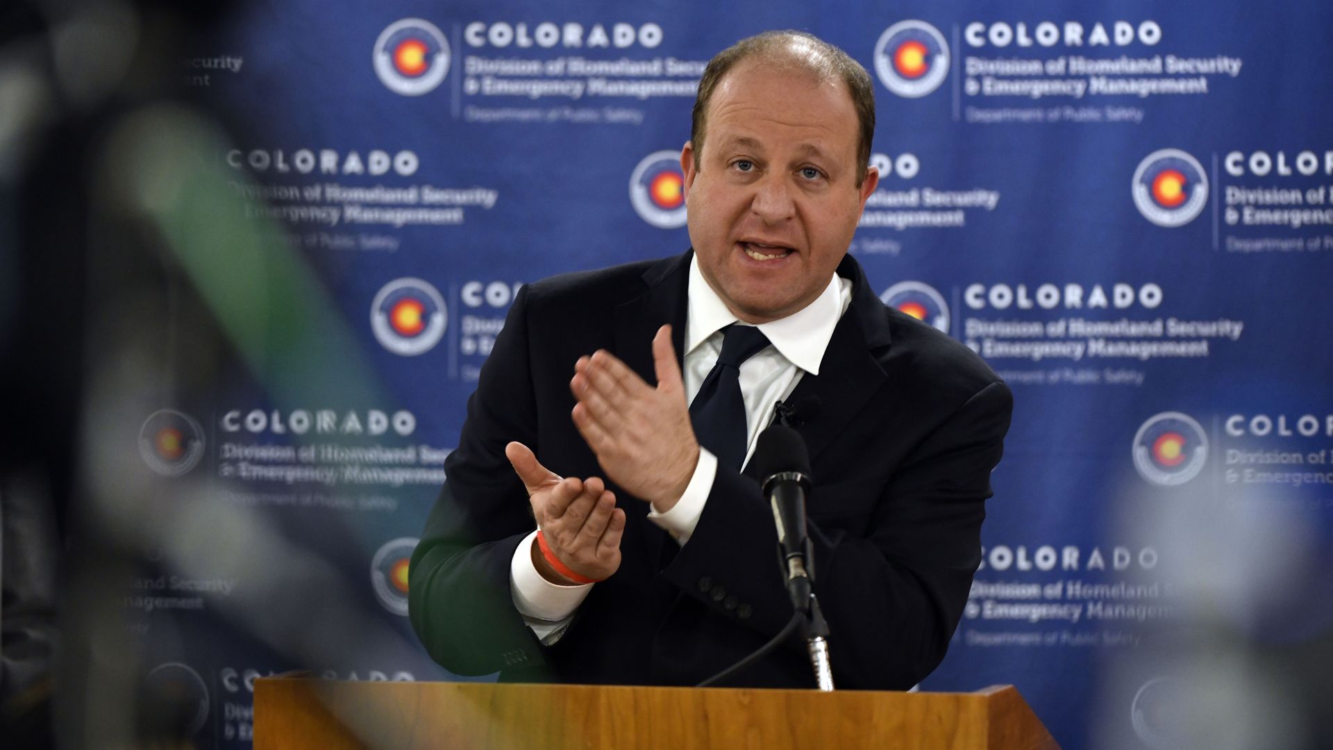 Colorado Gov. Jared Polis announces new public health orders in March 2020.