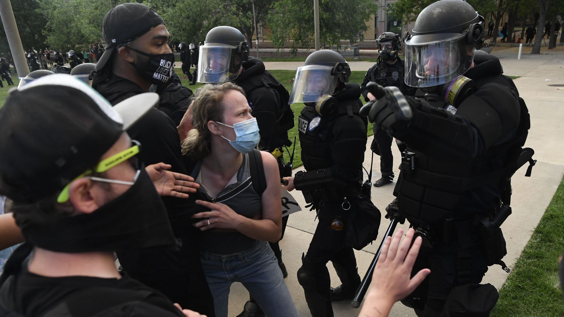 Demonstrators clash with police officers during a protest in Aurora, Colorado. 