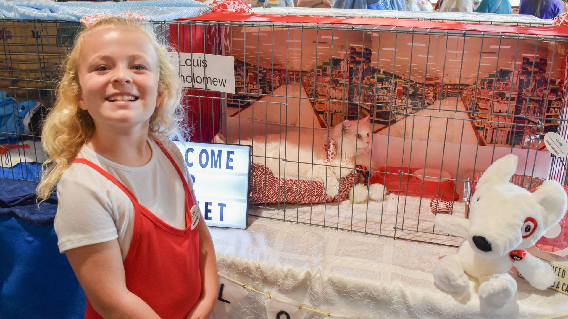 A picture of a girl with a cat.