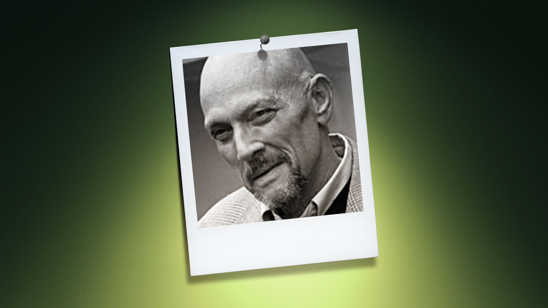 Photo illustration of John Shelton Reed in the center of a Polaroid photo under a green spotlight.