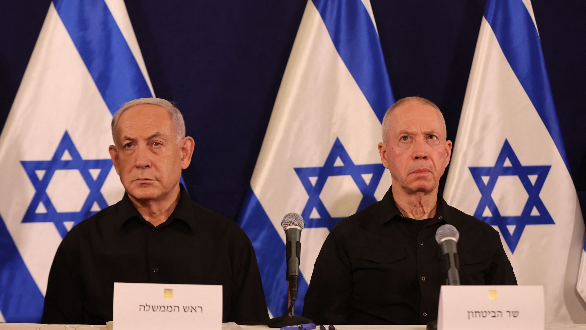 Israeli Prime Minister Benjamin Netanyahu (L) and Defence Minister Yoav Gallant attend a press conference in the Kirya military base in Tel Aviv on October 28, 2023