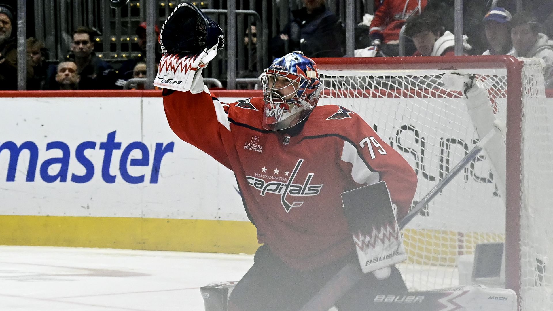 Goaltender Charlie Lindgren makes a save on the ice