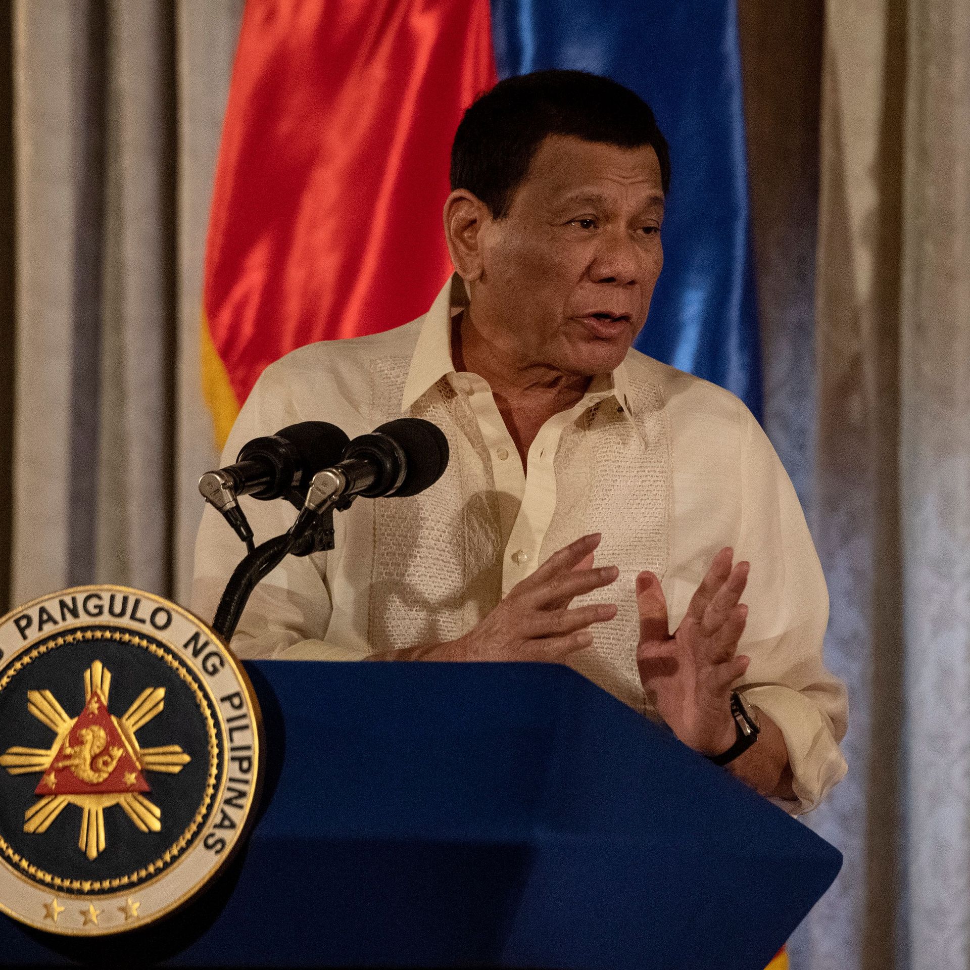 Rodrigo Duterte speaking at a lectern