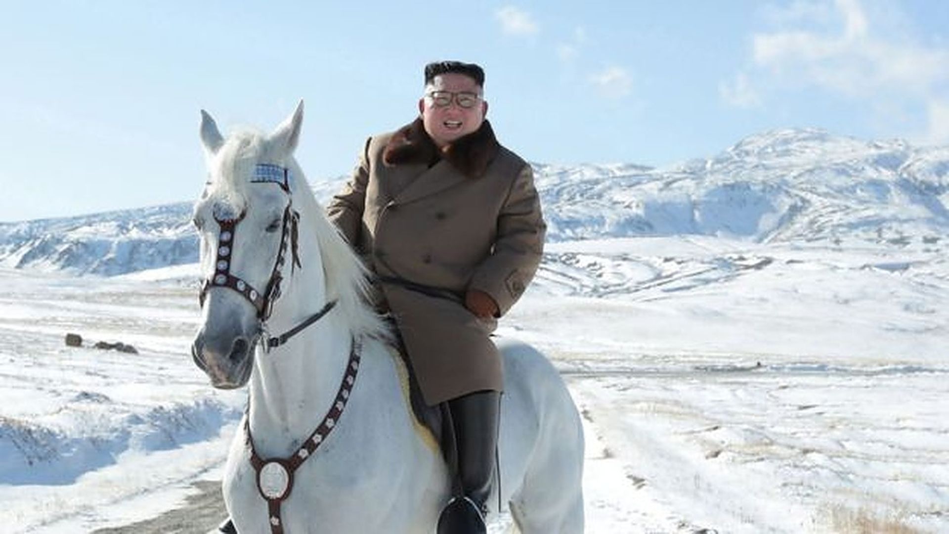 A North Korean state media photo of leader Kim Jong-un atop a white horse in the snow in North Korea.