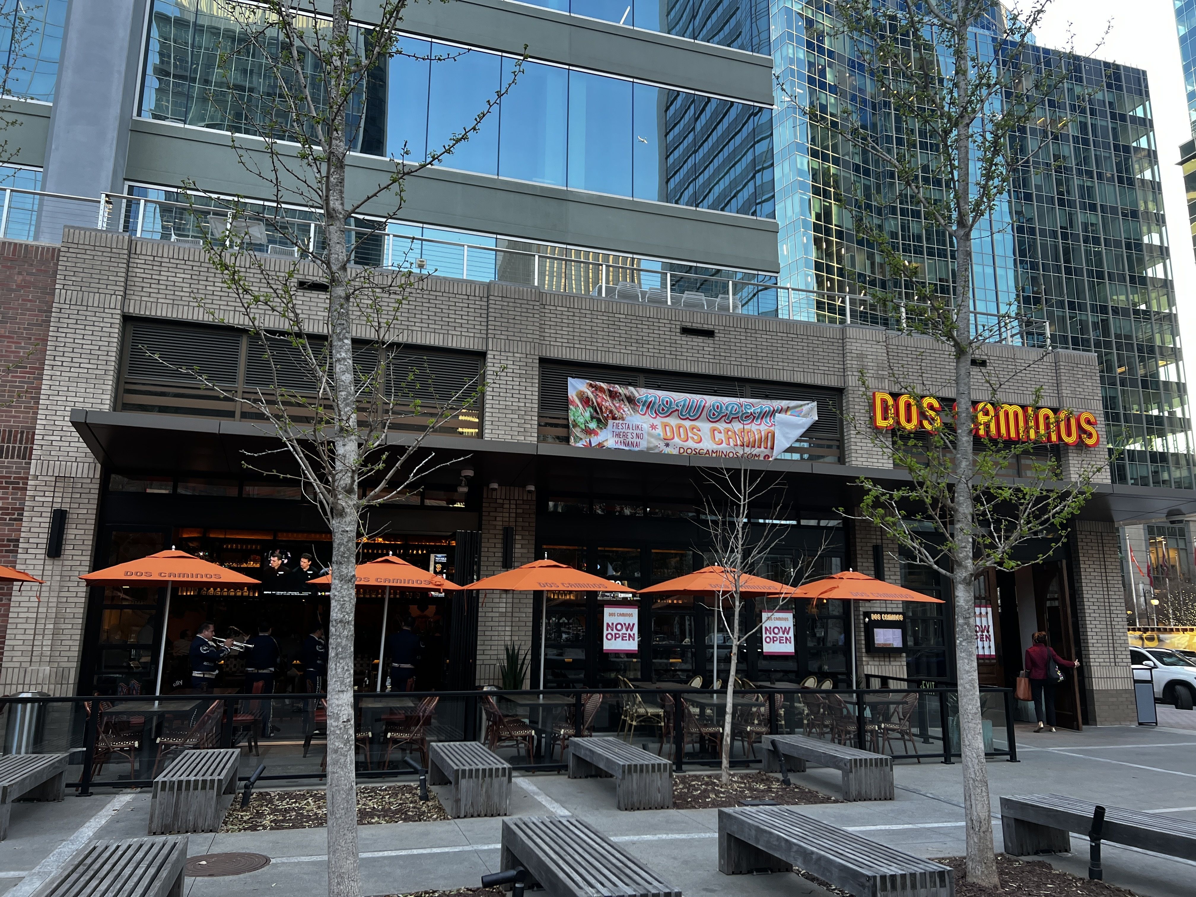 outside of restaurant with large patio with umbrella covering