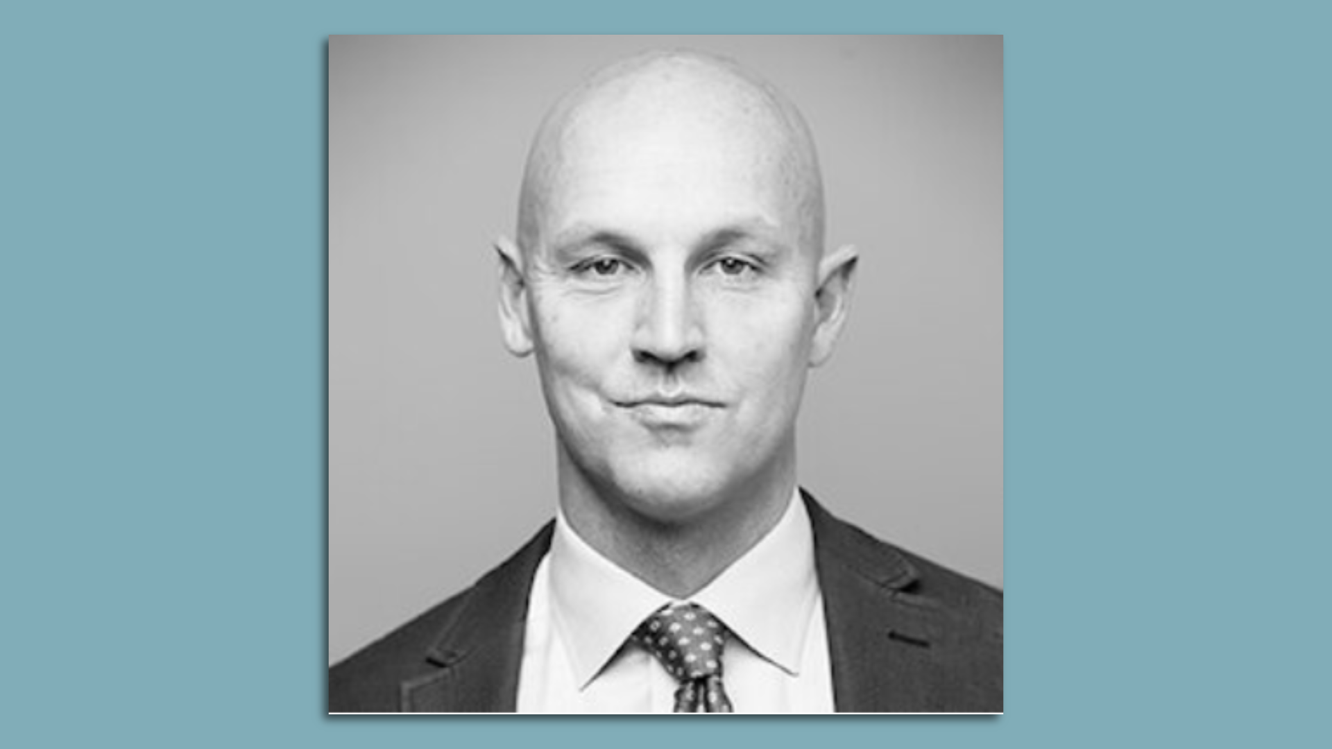 Headshot of a bald man