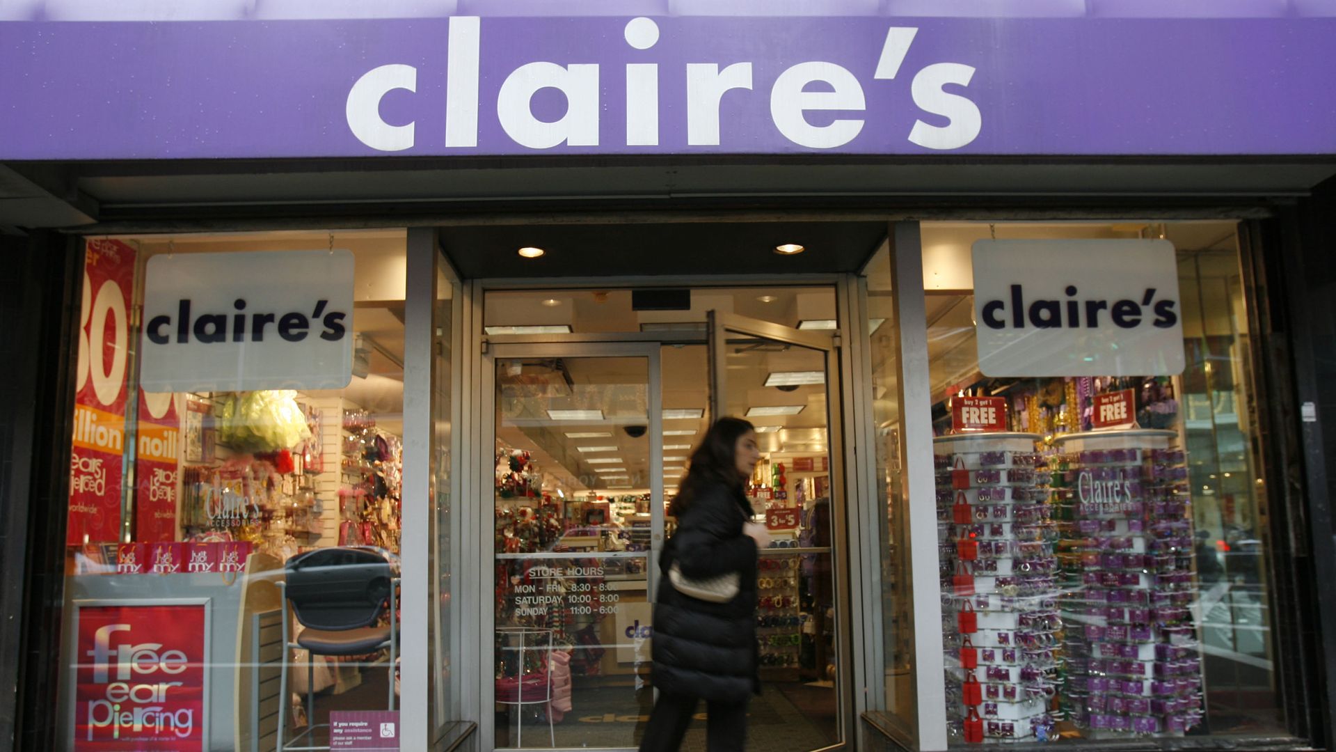 UNITED STATES - DECEMBER 01: A woman exits a Claire's store on Friday, December 1, 2006 in New York. Claire's Stores Inc., the retailer of jewelry for teens, said it hired Goldman Sachs Group Inc. to help it explore a possible sale of the company. 