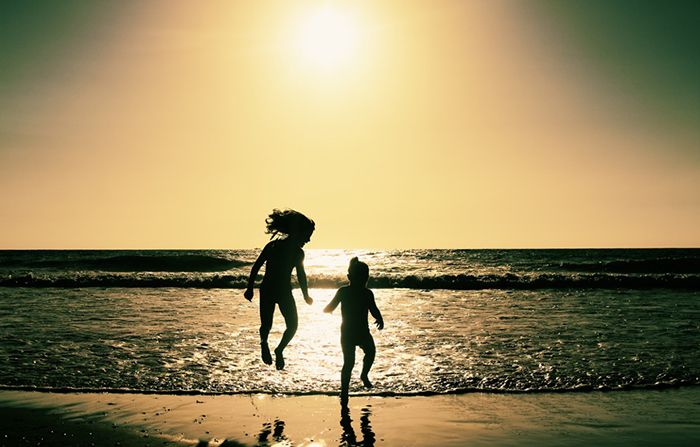 kids-on-beach-at-sunset
