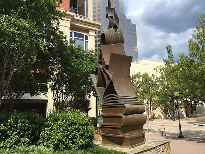 book statue on the green