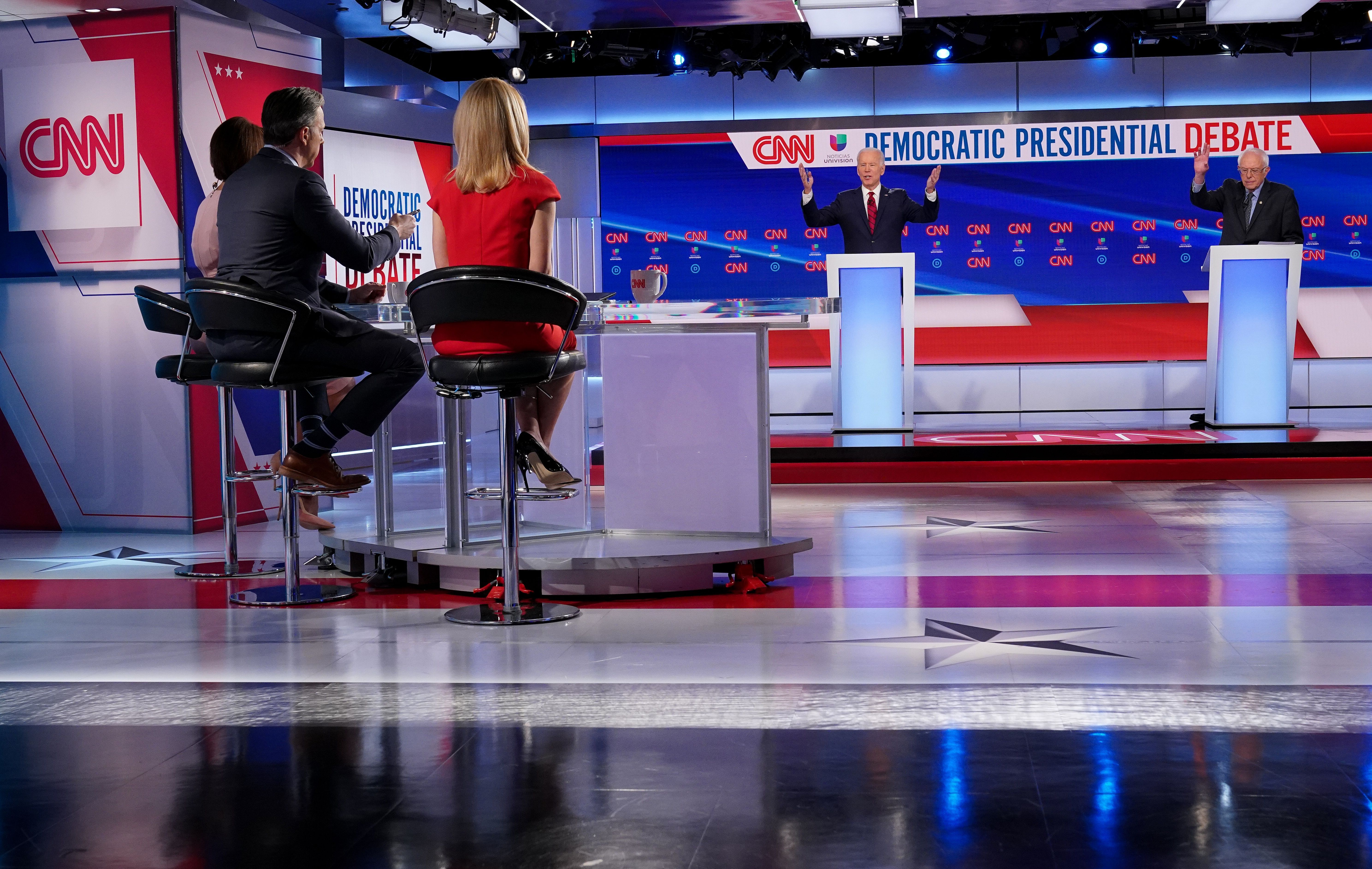 Moderators Univision's journalist Ilia Calderon (hidden), CNN chief Washington correspondent Jake Tapper and CNN political correspondent Dana Bash