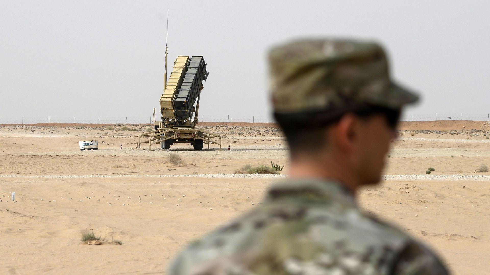 A member of the US Airforce looks on near a Patriot missile battery at the Prince Sultan air base in Al-Kharj, in central Saudi Arabia on February 20