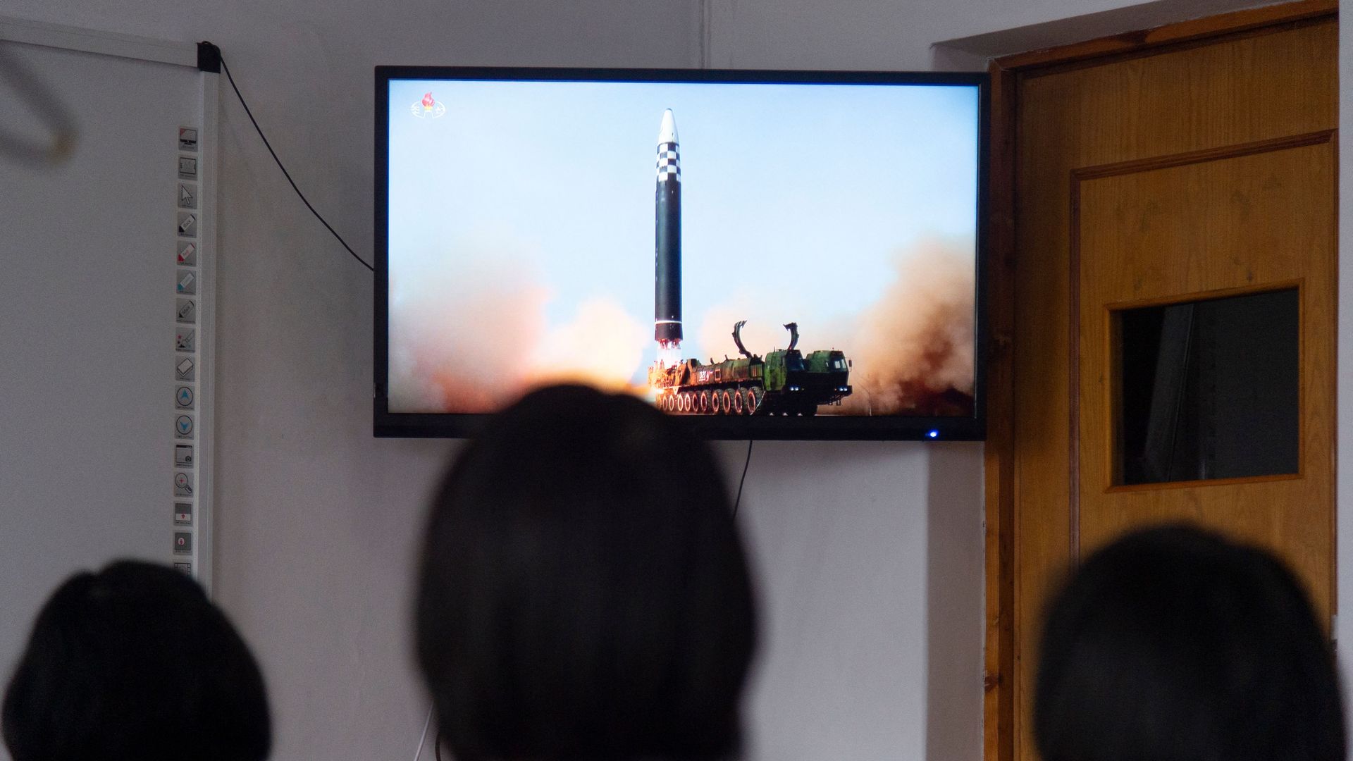 People in Pyongyang watching the missile launch on March 25.