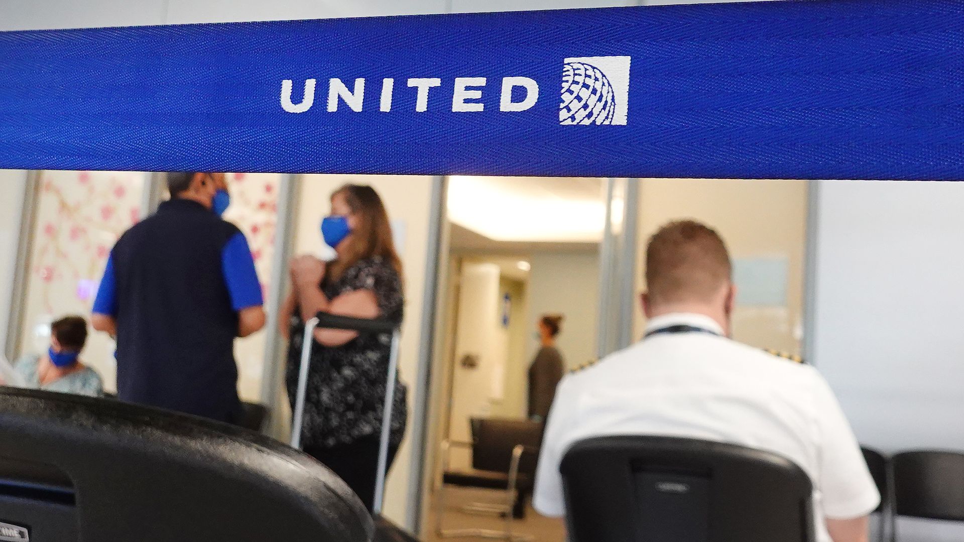 United Airlines workers arrive to receive COVID-19 vaccines at United's onsite clinic at O'Hare International Airport on March 09, 2021 in Chicago, Illinois. 