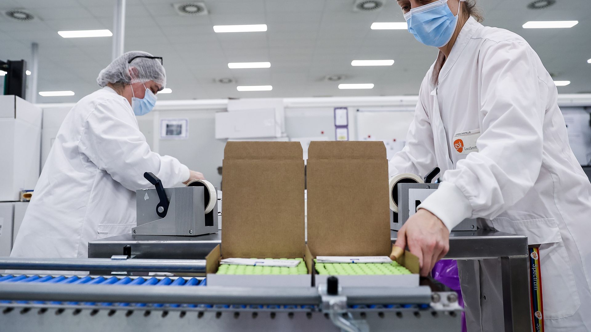 Photo of an employee wearing scrubs at work at the factory of British pharmaceutical company GlaxoSmithKline