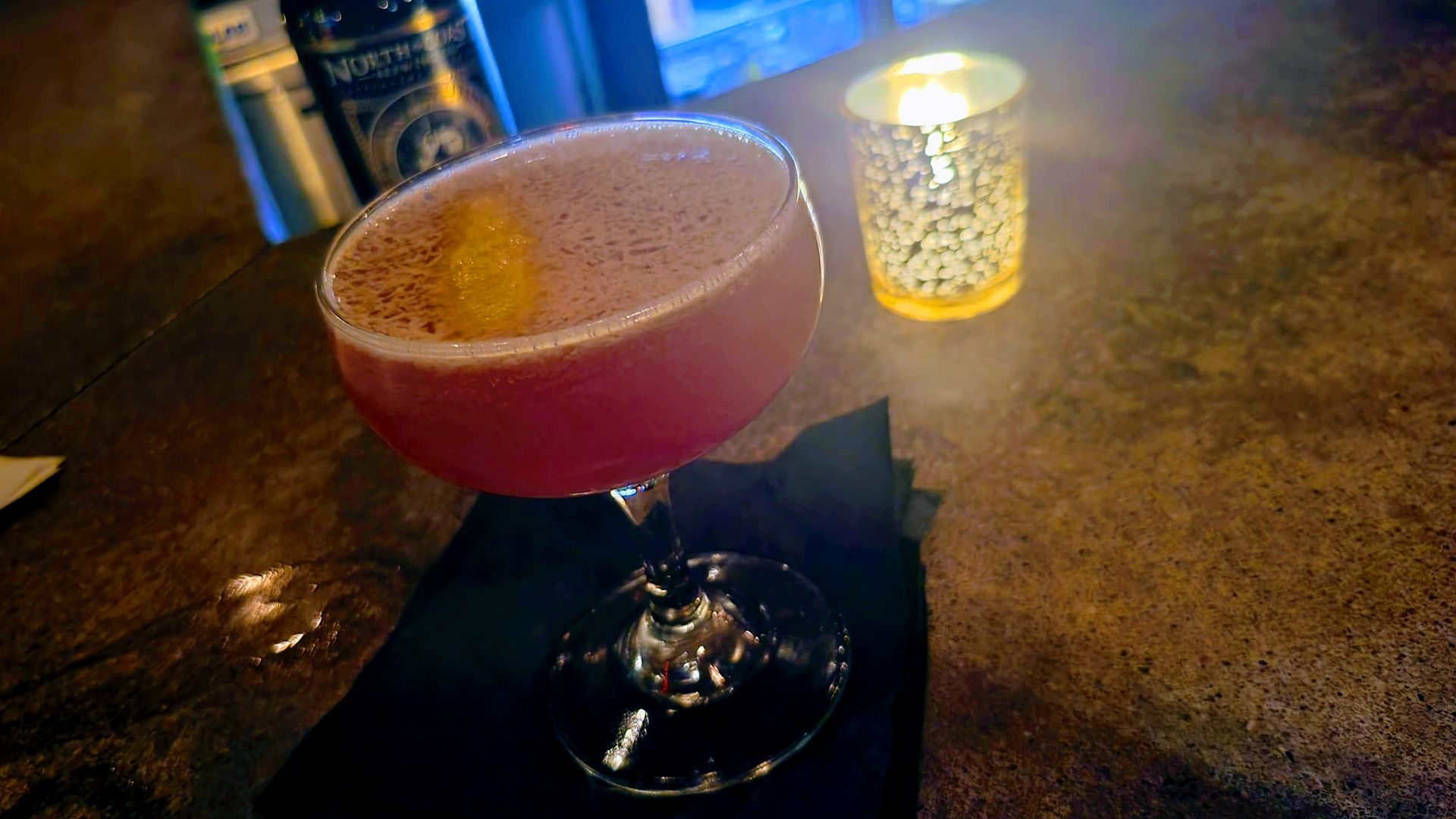 A cocktail on a bar