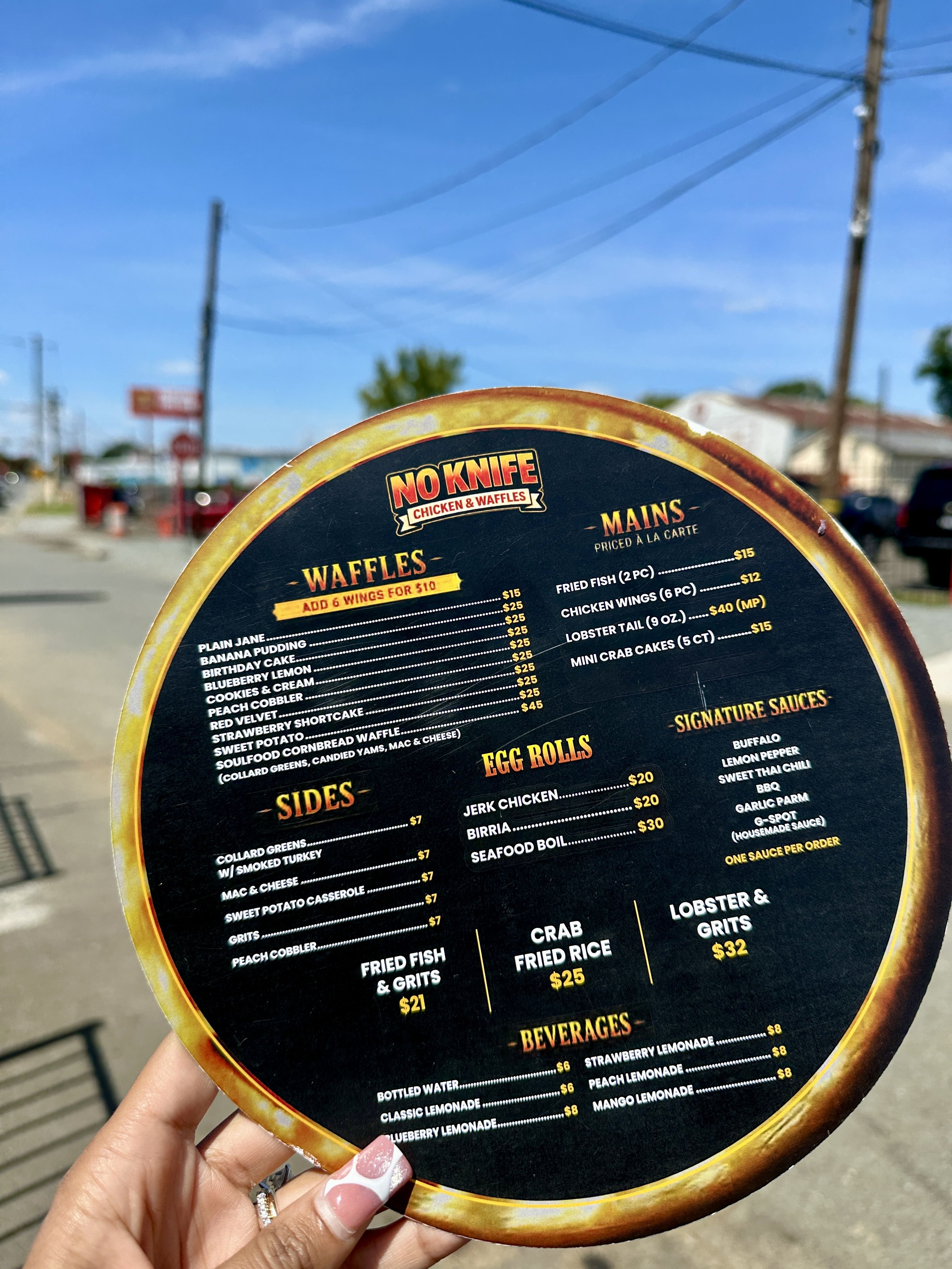 the menu at no knife chicken and waffles dababy charlotte restaurant