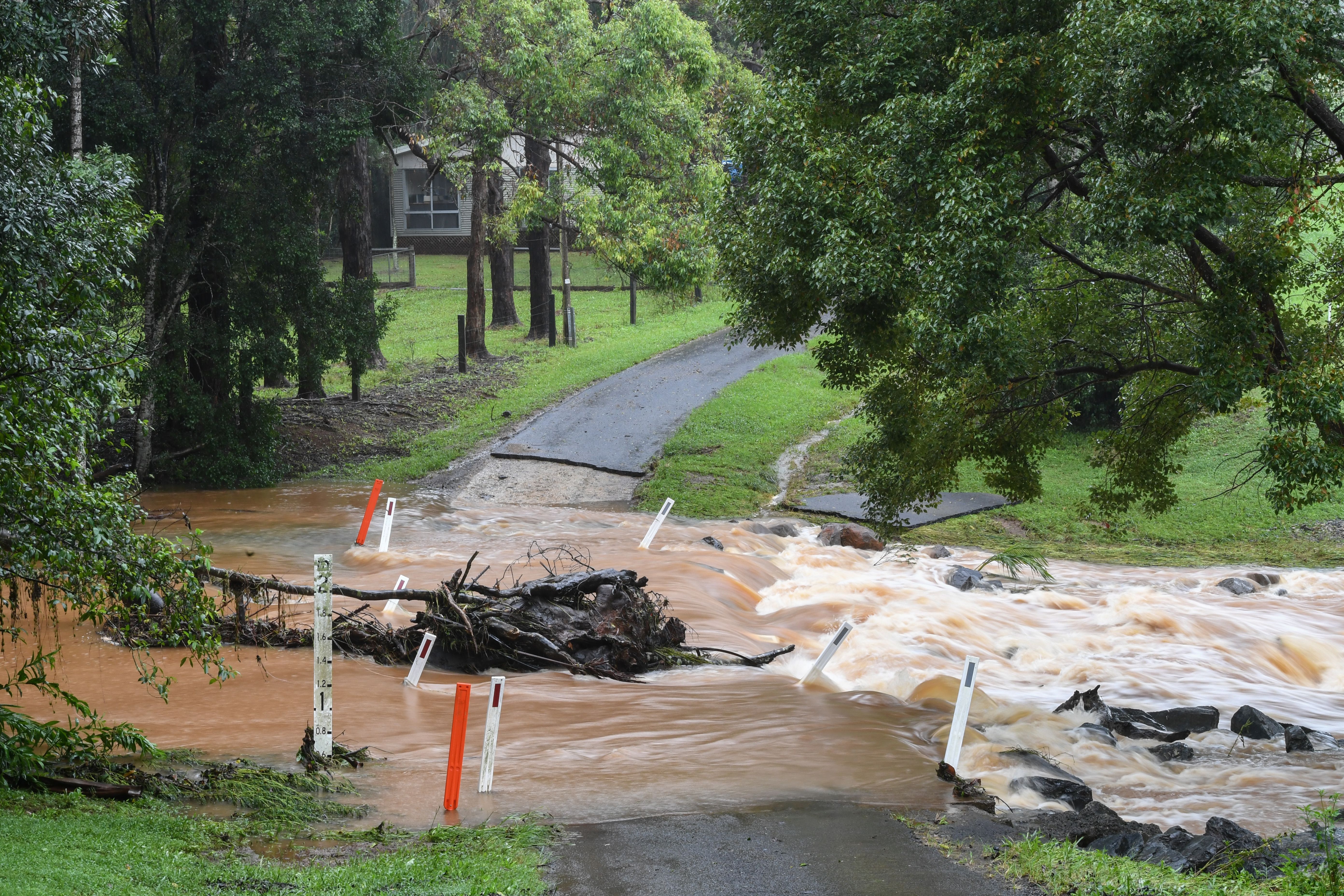 A road is made impassable by recent rainfall on March 22, 2021 in Byron Bay, NSW, near the Queensland border. 