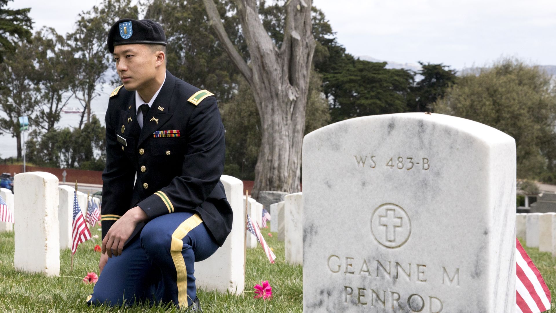 Army National Guard Military policeman Alan Wong sits near a headstone during the annual Memorial Day observance held at the Presidio Cemetery in San Francisco, Calif. Monday, May 27, 2019. (Photo by Jessica Christian/San Francisco Chronicle via Getty Images)