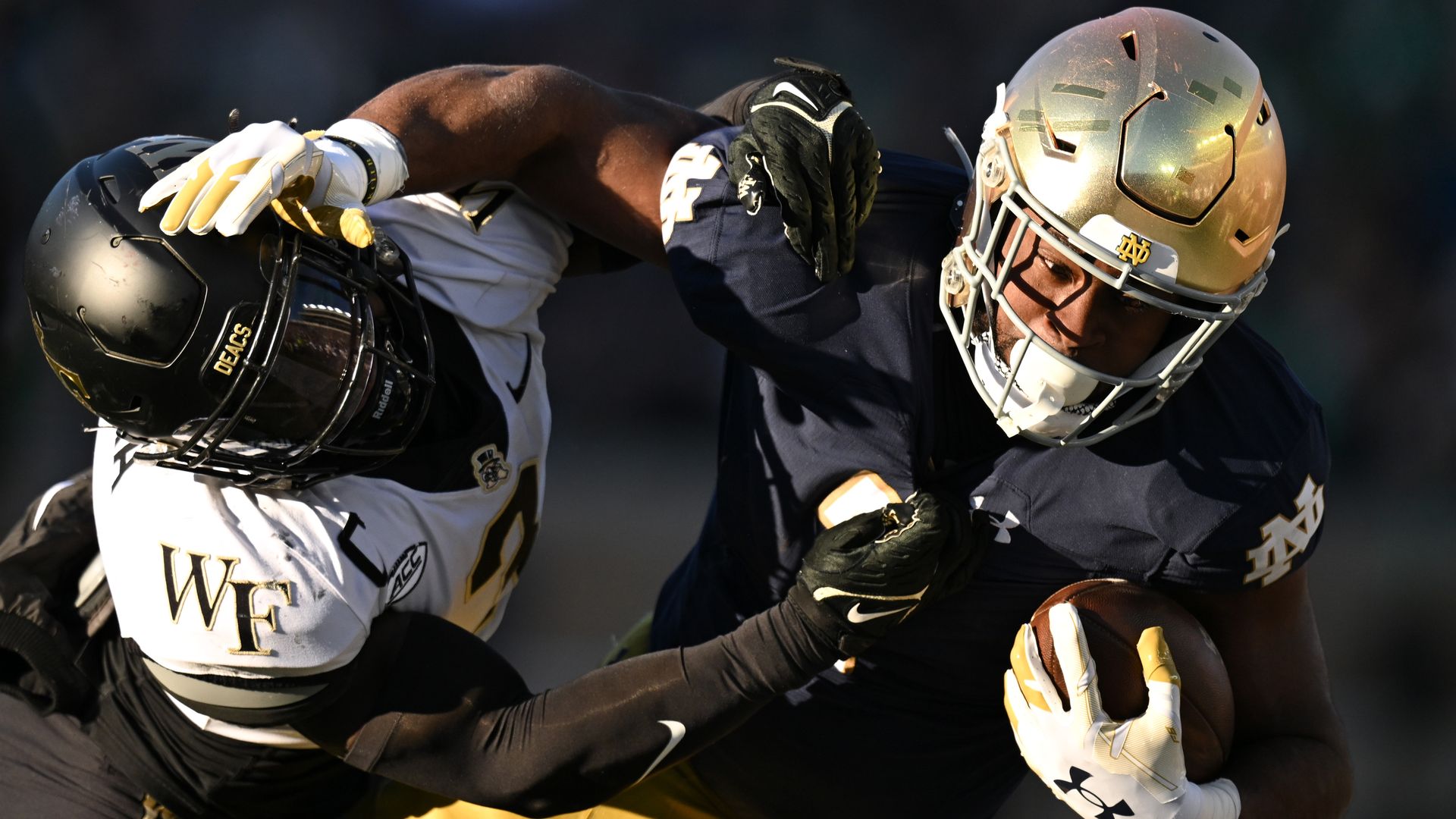 Wake Forset's Malik Mustapha tackles Notre Dame's  Audric Estime. 