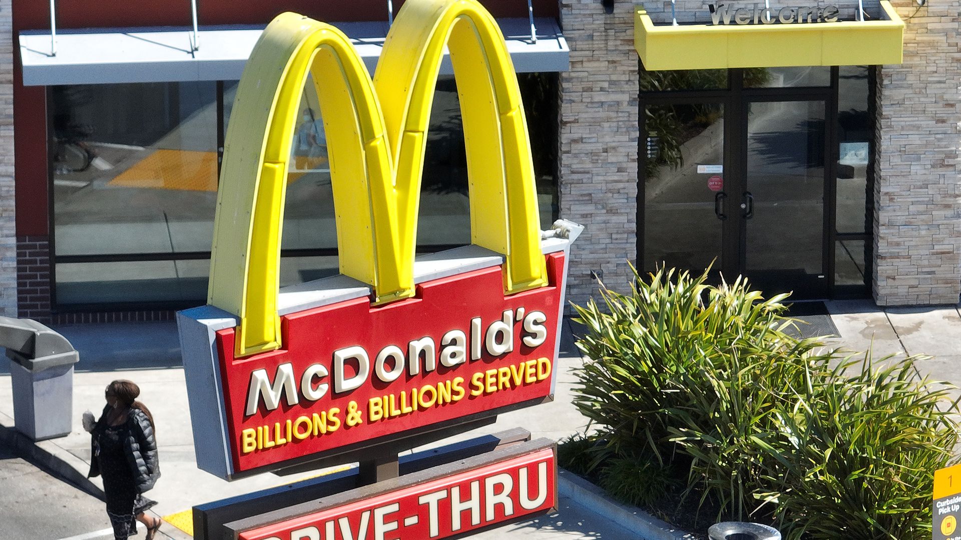 McDonald's sign in front of a restaurant location
