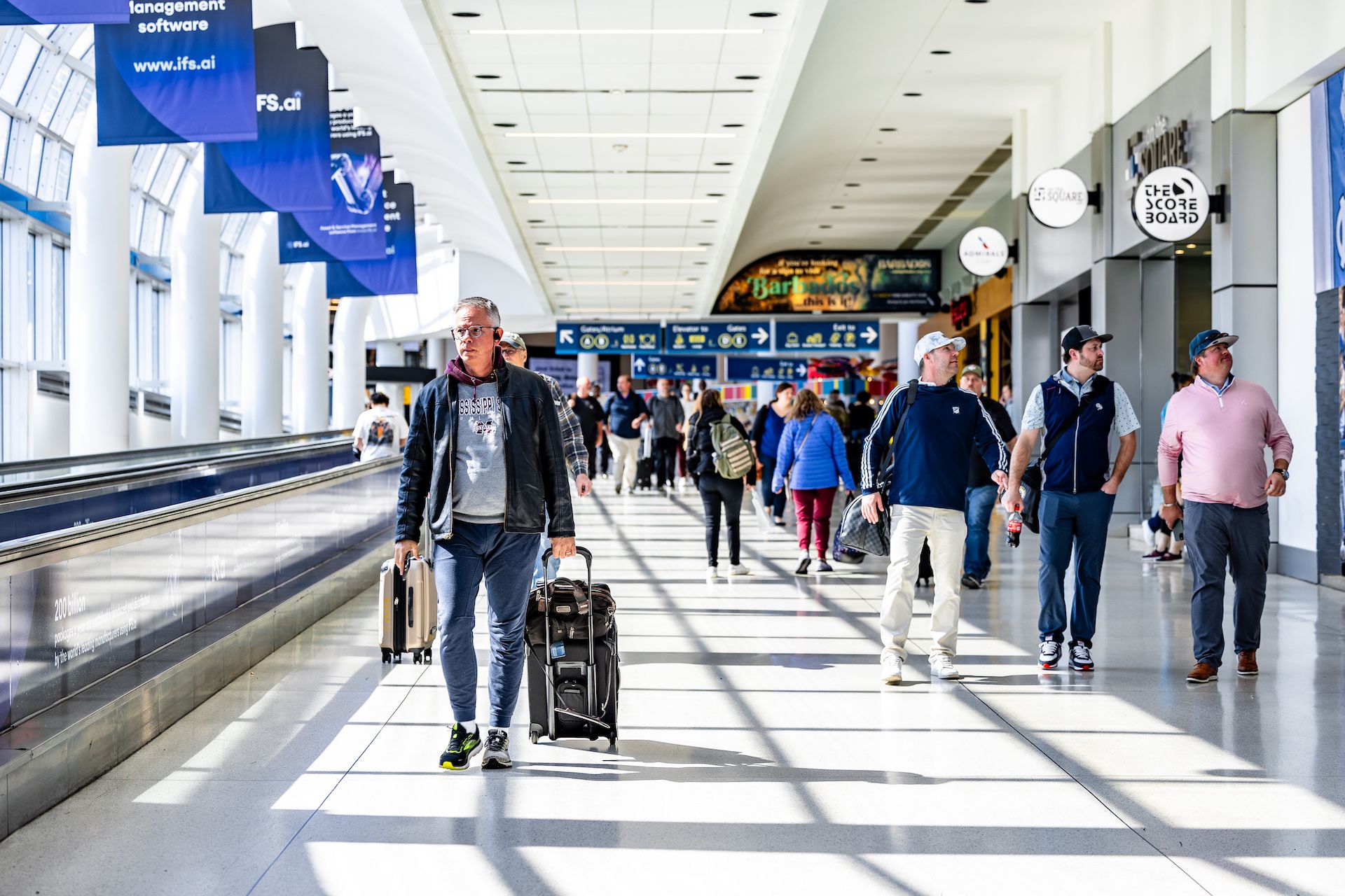 A group of people in an airport.