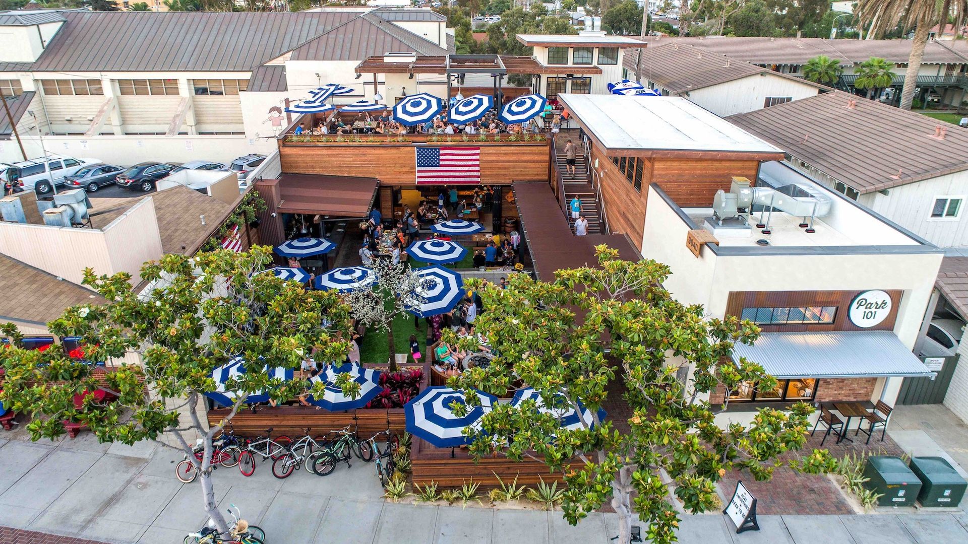 An aerial photo of a restaurant with large outdoor patios.