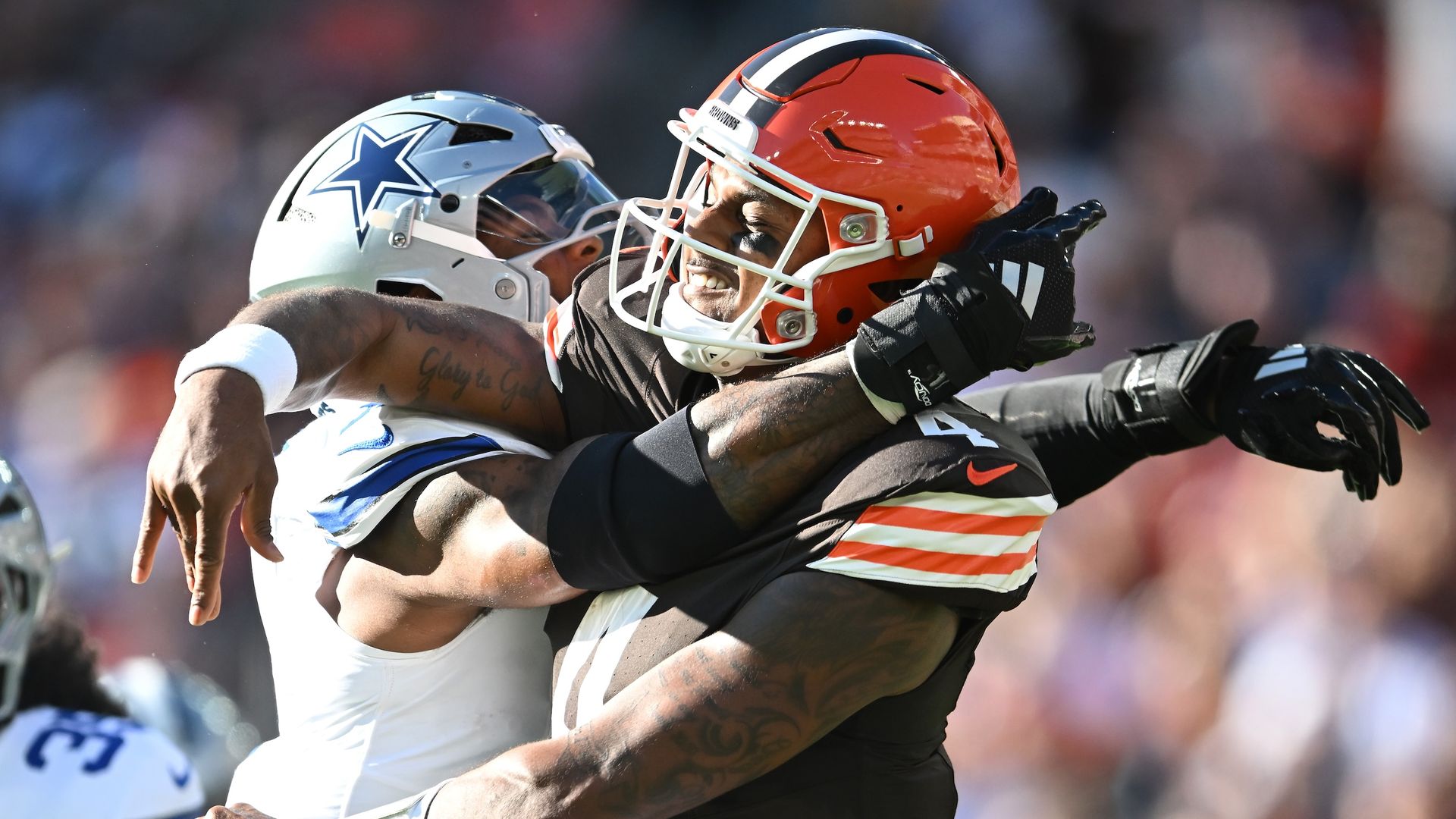 A Dallas Cowboys player hits Browns quarterback Deshaun Waston.