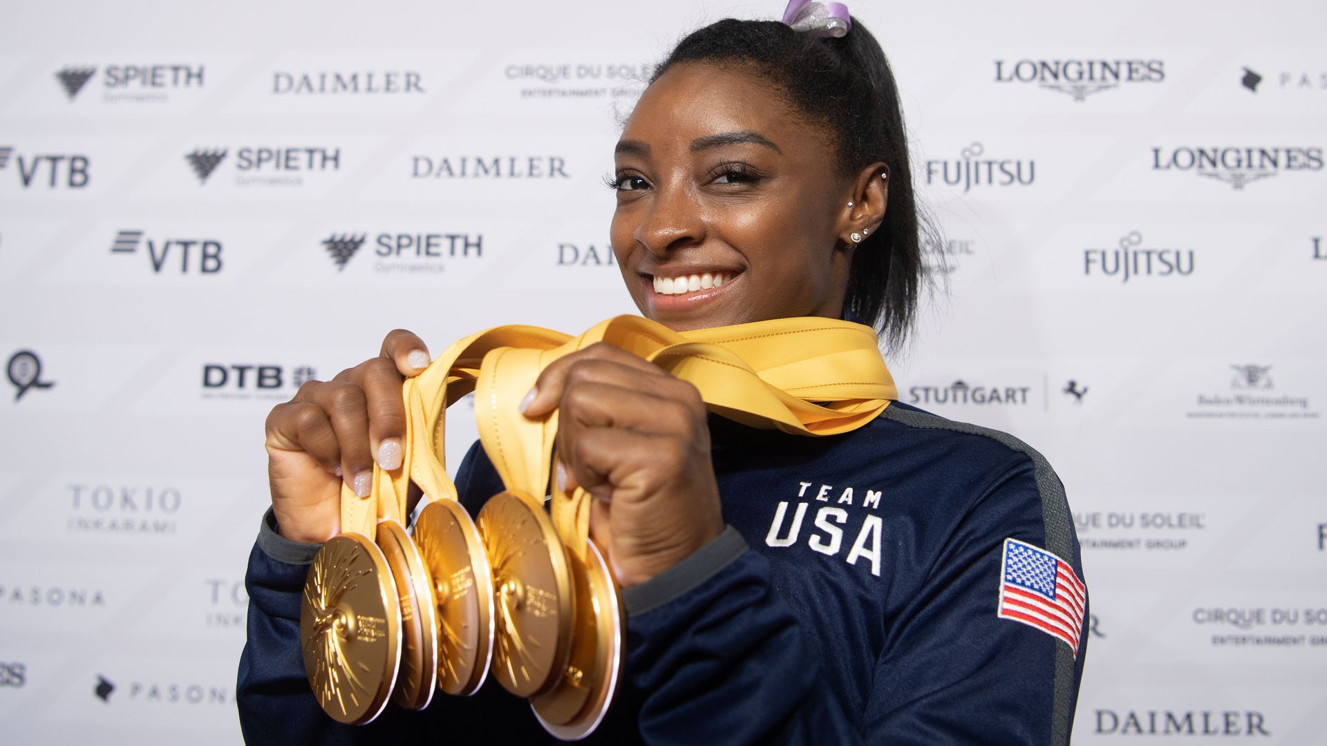 Gymnast Simone Biles holds five gold medals from the 2019 World Championships. 