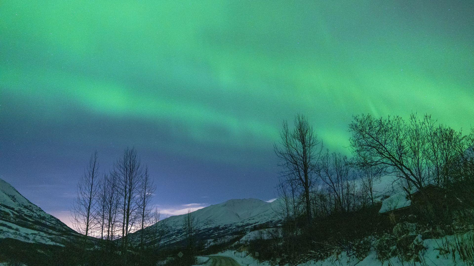 The Northern Lights (Aurora Borealis), which emerge as a result of the interaction between the Earth's magnetic field and charged particles coming from the Sun, are seen in the Hatcher Pass region of Alaska, United States on November 9,
